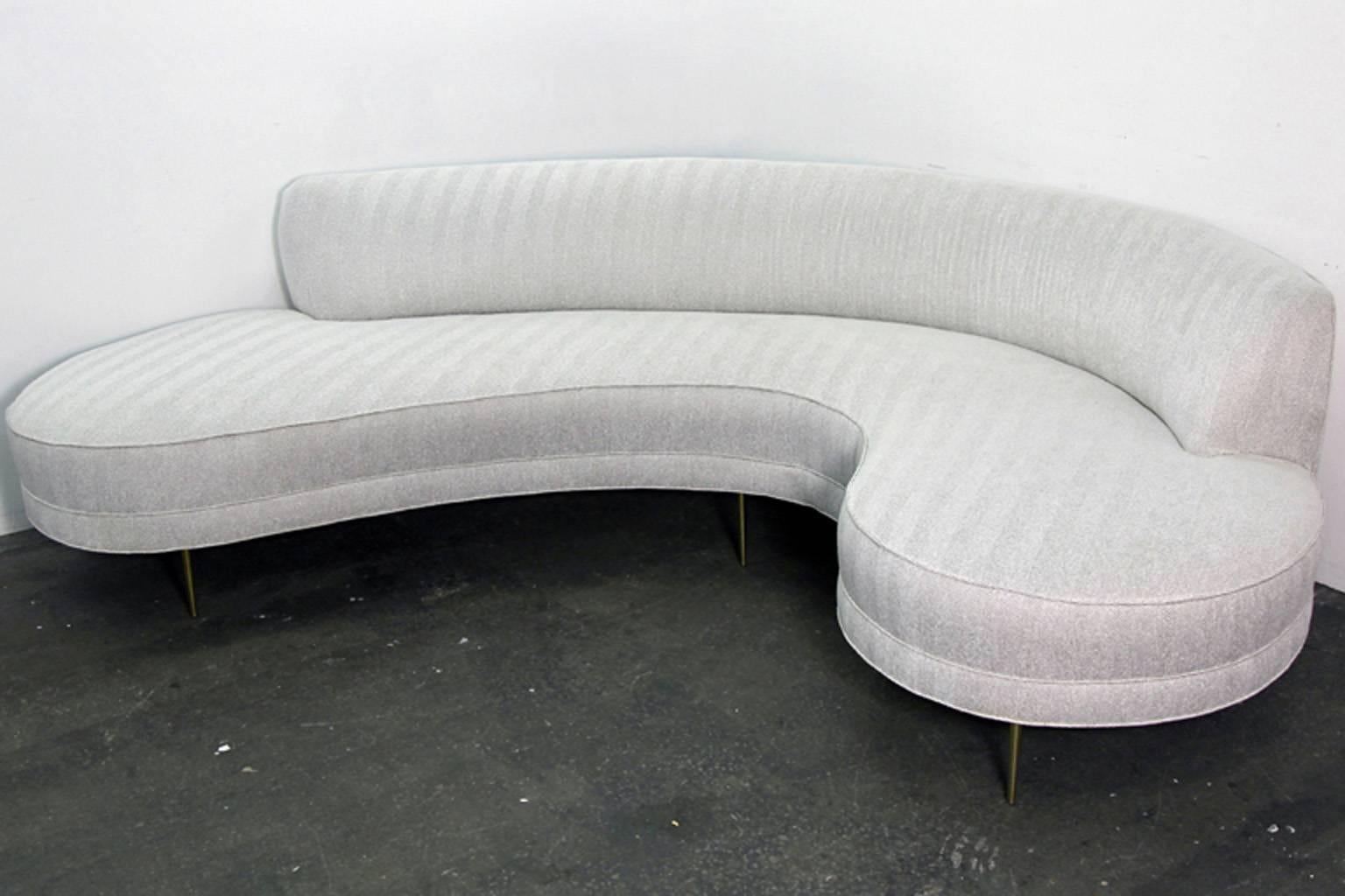 Incredible curved Mid-Century sofa originally used in famous New York City photography gallery. Could very well have been an original Valdamir Kagan, but no original tags or labels existed. The sofa has been completely re-upholstered in woven