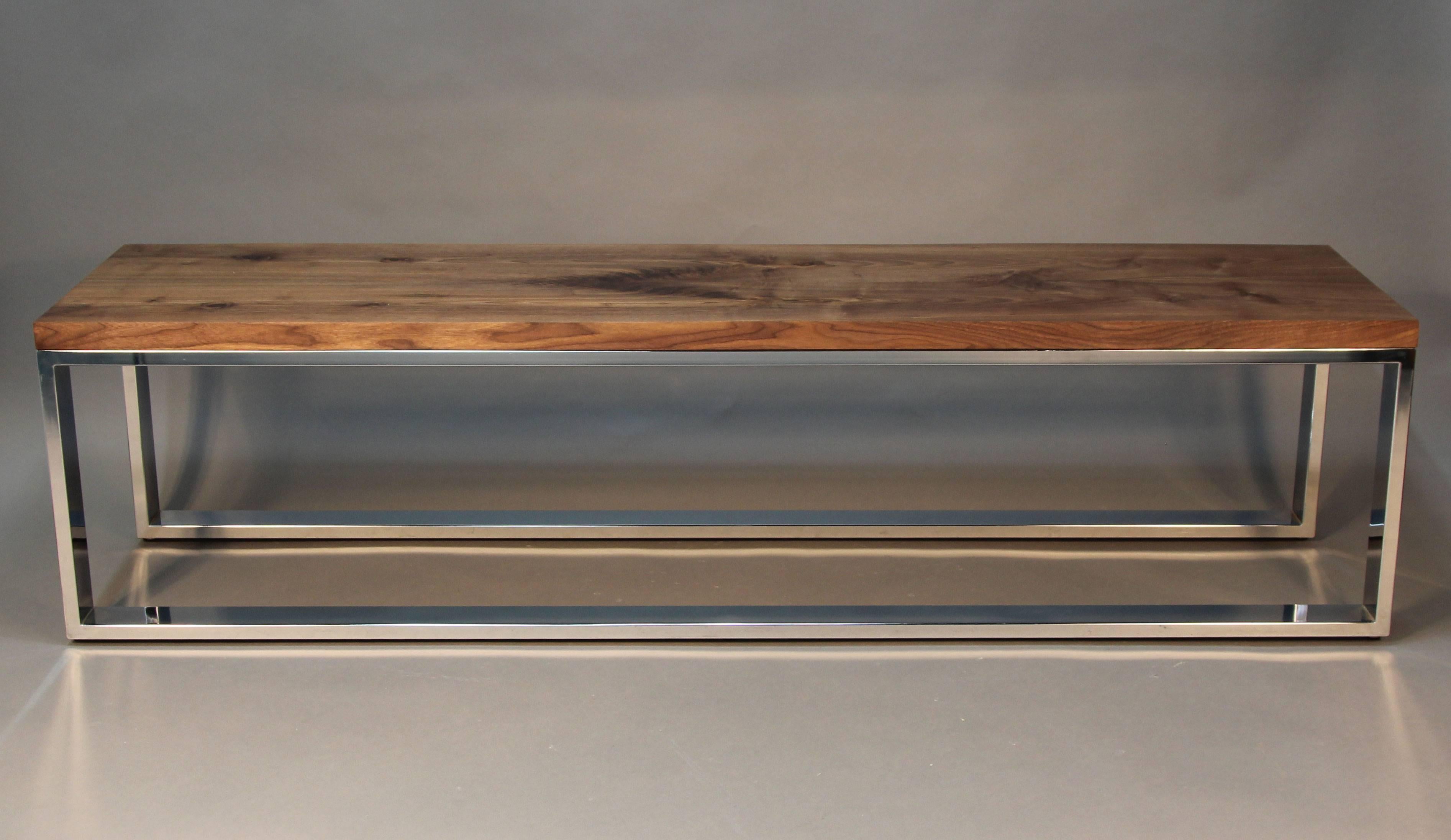 Beautiful heavy chrome base with raw wood walnut top. Sleek Mid-Century style, with stylish wood detail.