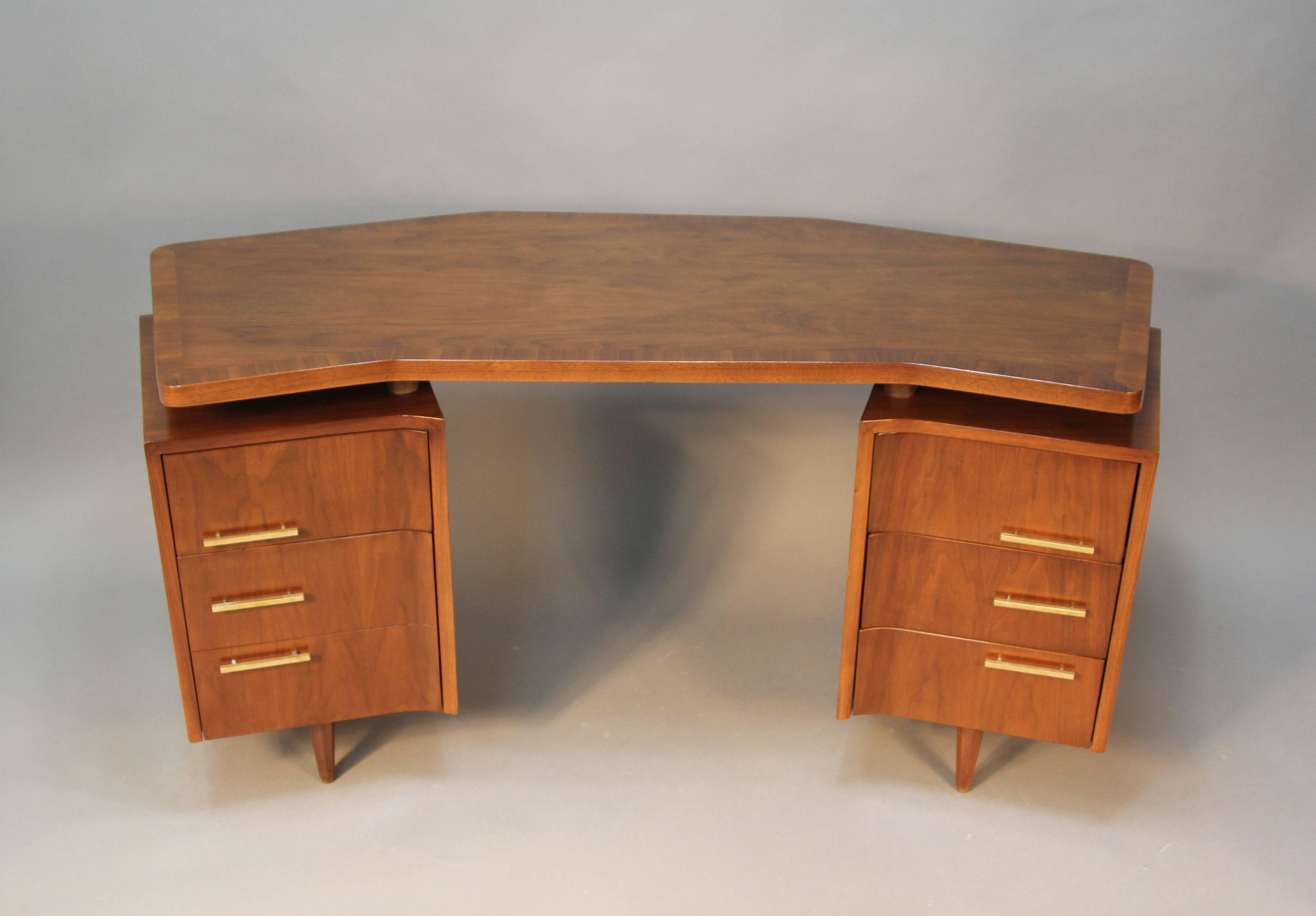 Very unique but incredibly detailed Mid-Century floating top desk. Gorgeous offset brass pulls, octagonal feet. Newly refinished mahogany wood. A stung piece for home or office.