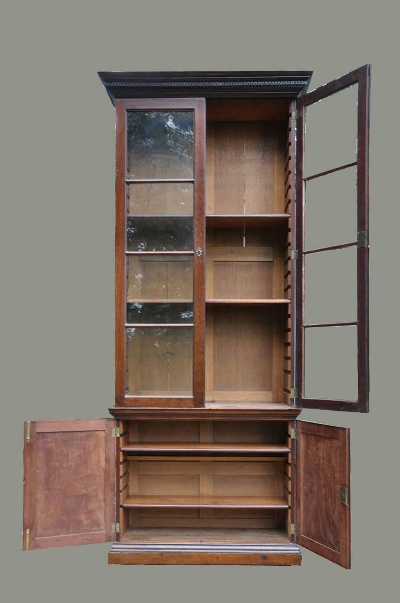 18th century Georgian secrétaire bookcase. A fine Georgian mahogany library bookcase with running dental cornice. Top and bottom original with adjustable shelves. 

Purchased at the Olympia in London.