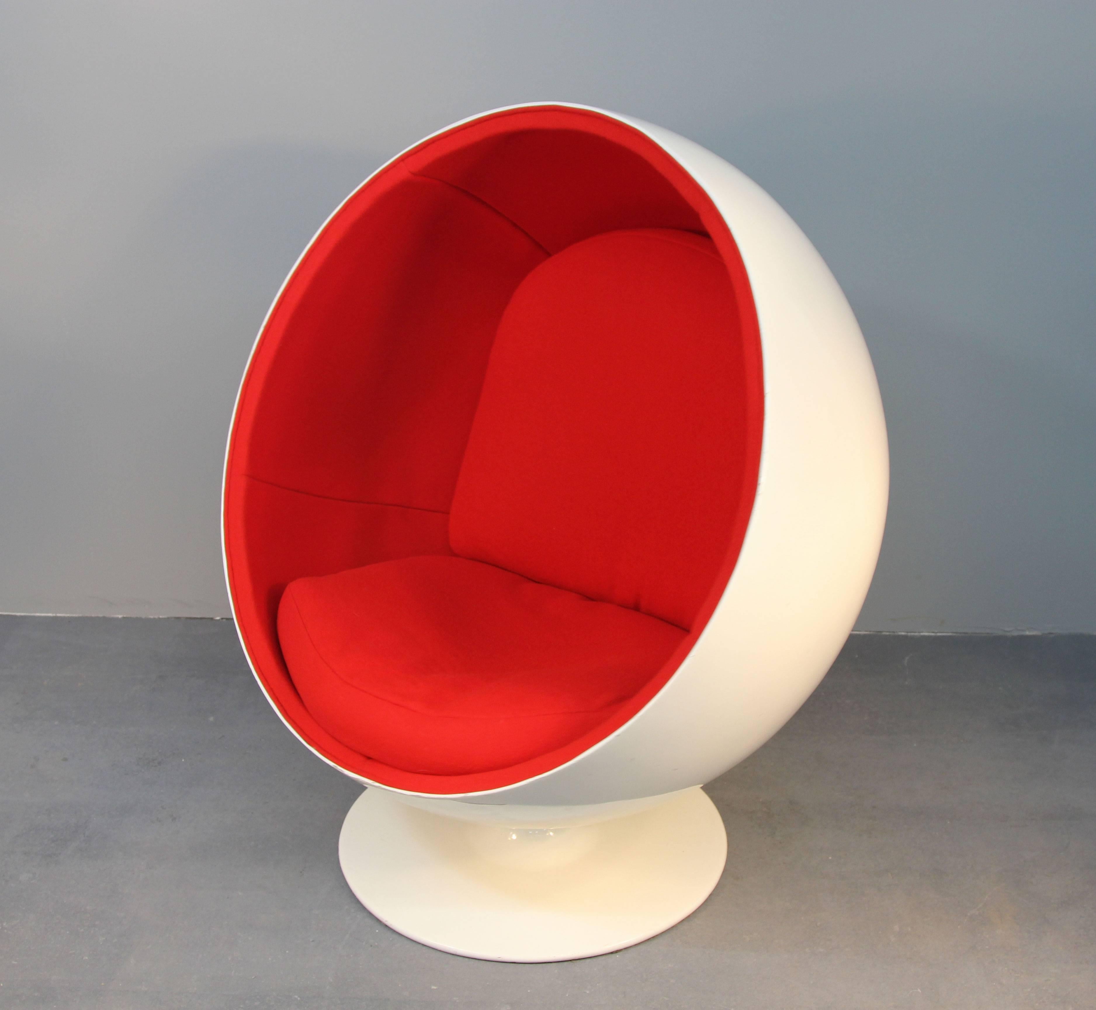 Amazing example of 1960s design. The Eero Aarnio ball chair made of fiberglass, aluminum, and newly upholstered in vibrant red upholstery. Swivels 360 degrees, very comfortable, incredibly stylish.