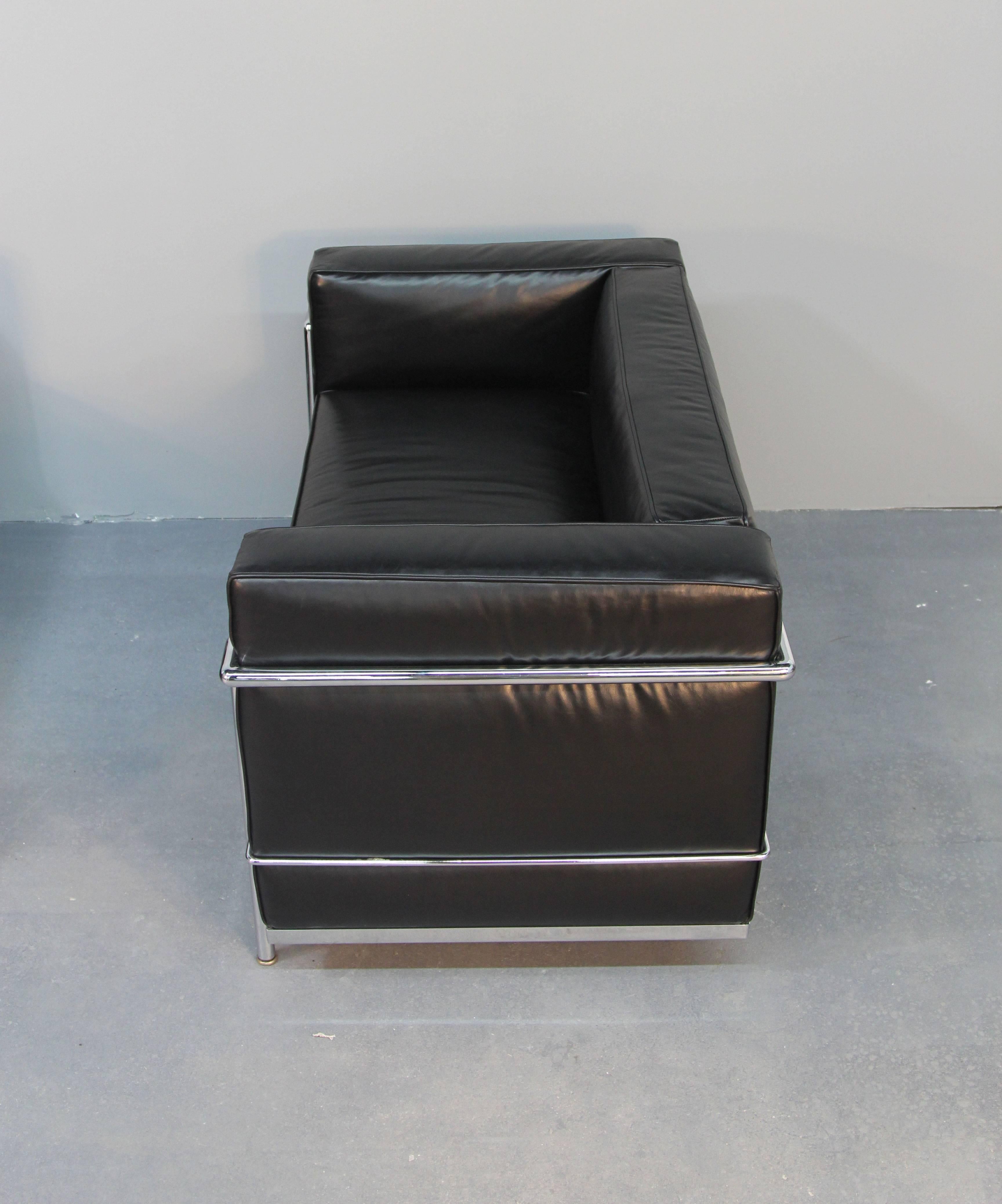 Beautiful signed LC2 Le Corbusier love seat.  With chrome frame and black leather cushions.  Amazing iconic style and luxury comfort.