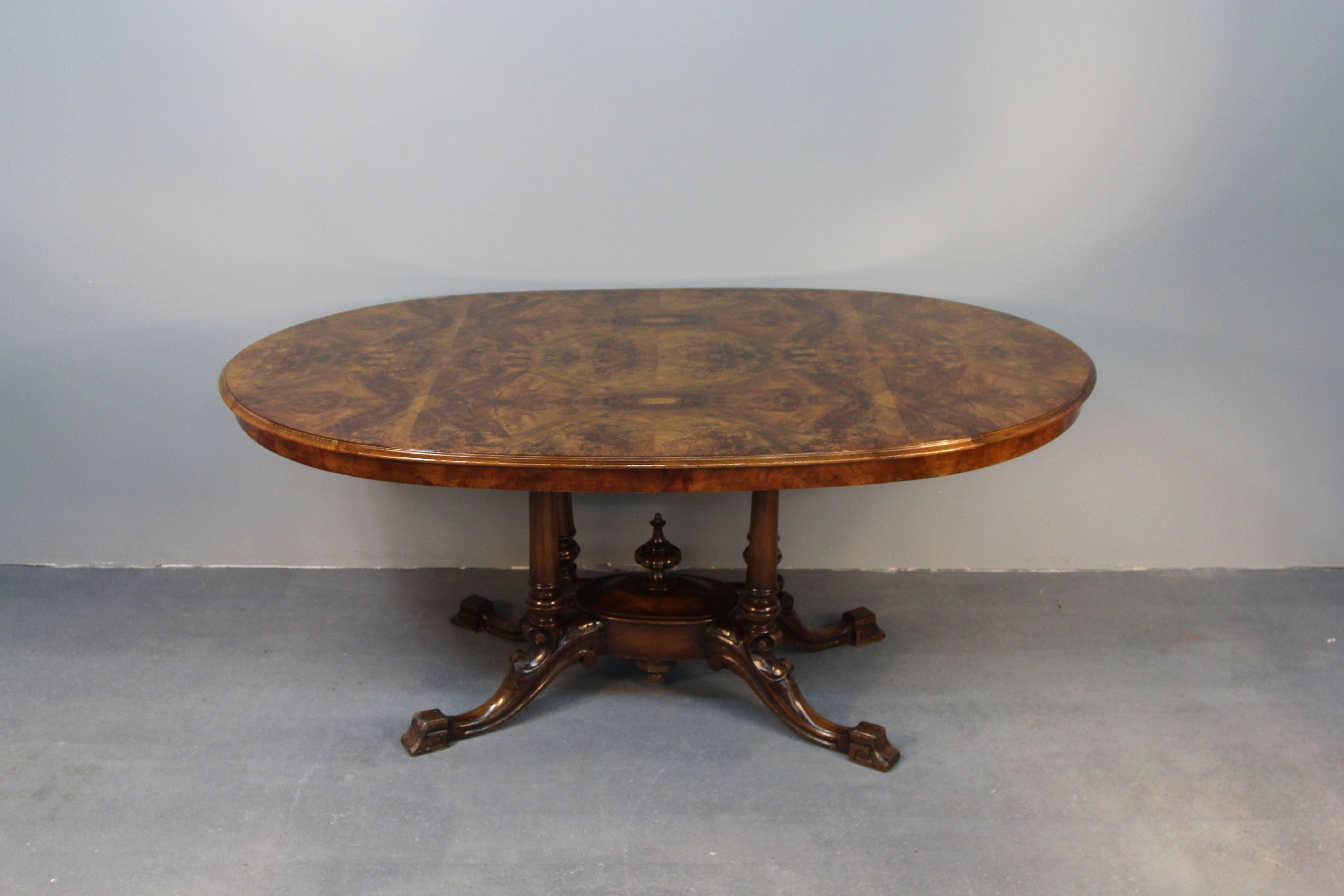 Oval vintage walnut dining table with burled walnut top. Perfect for six comfortably.