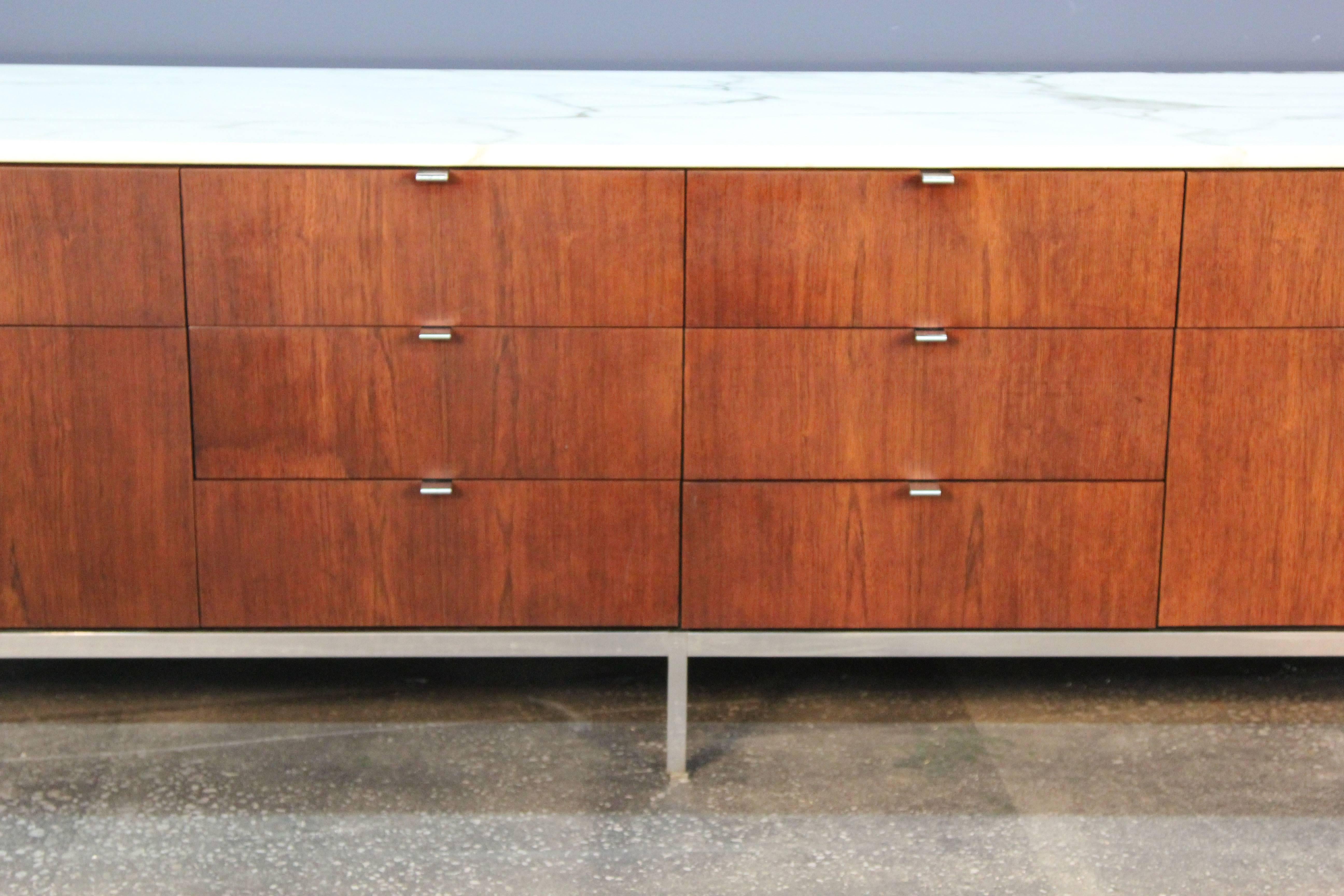 Incredible Knoll credenza / file cabinet on chrome base with Carrara marble top. Eight small drawer and two double draws with files. With original working lock (no key included).