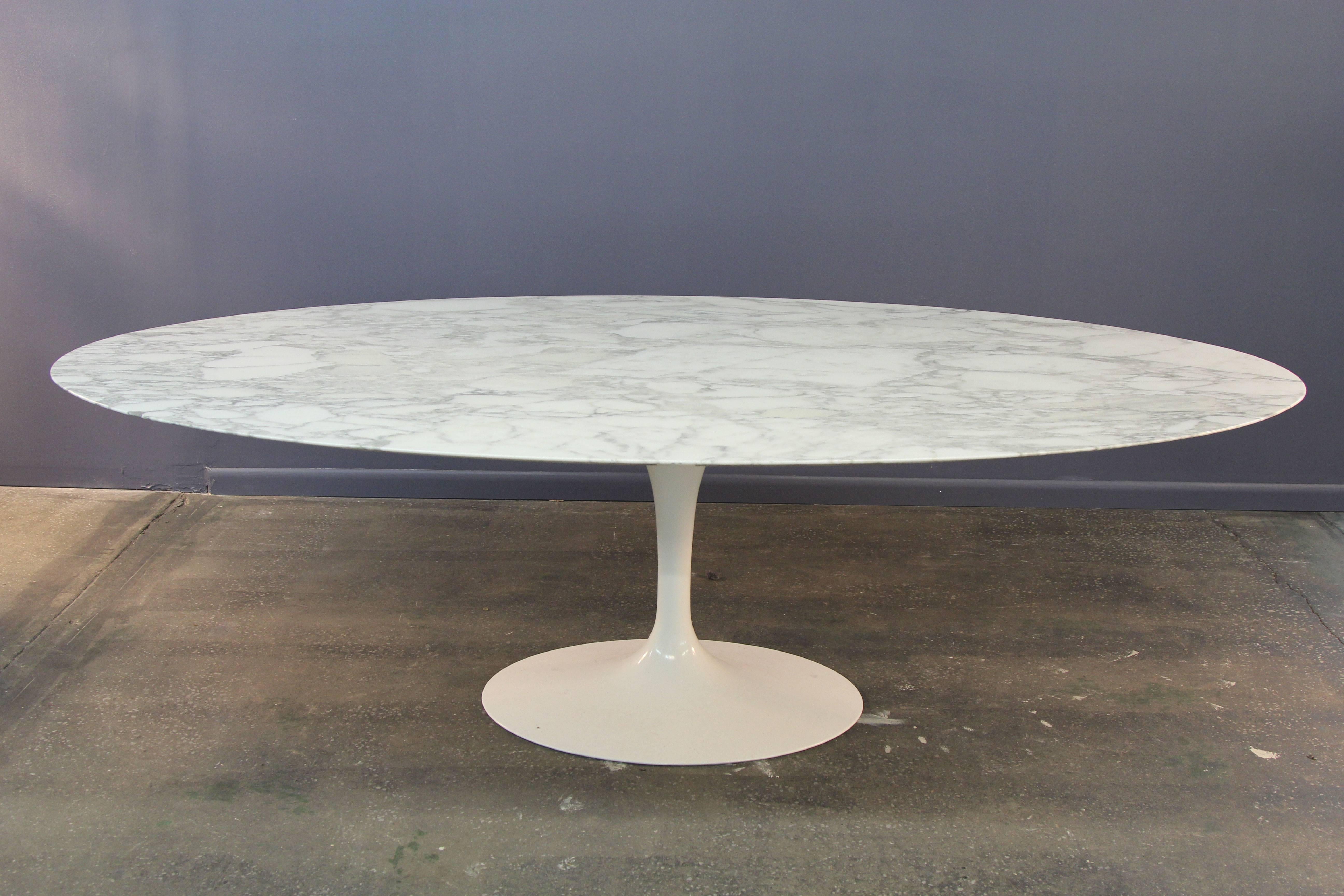 The 96 inch Saarinen in Arabescato marble is an amazing table. Knife edge marble top on white cast aluminum tulip base. Signed Saarinen Knoll. Professionally polished marble.