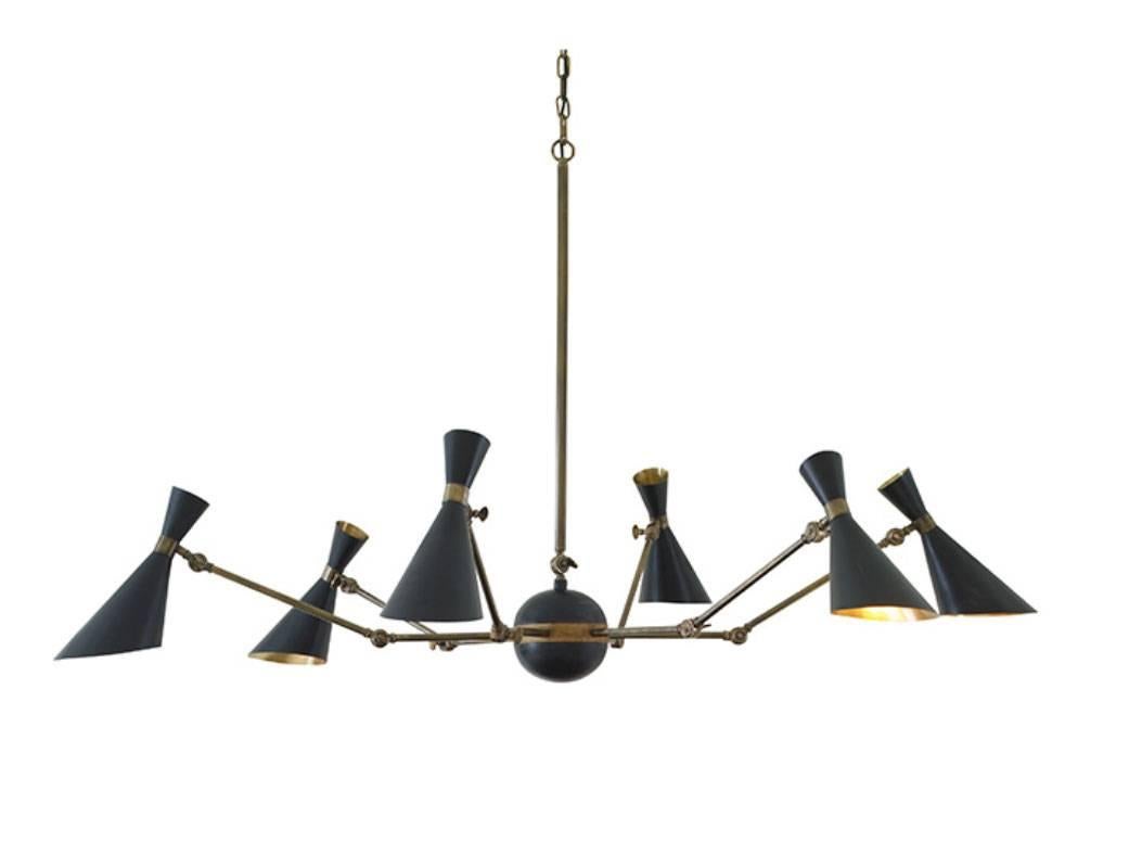 Inspried by Italian lighting designs of the 1950s, the Bacco chandelier features six articulating brass arms with steel shades. The Bacco captures the elegant and functional qualities that defined designs of the mid-20th century. Designed by Julian