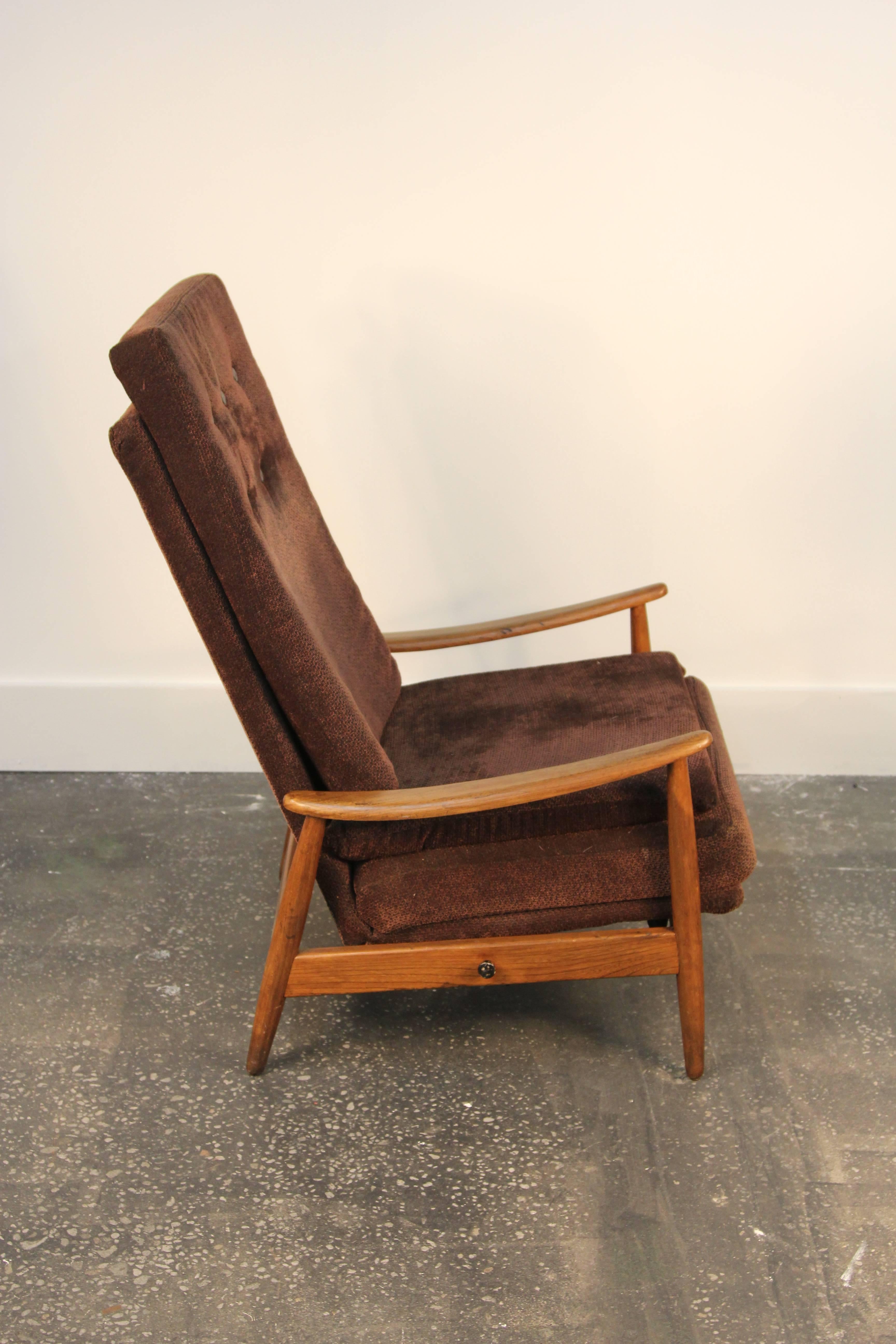 This is a very rare and early Milo Baughman designed reclining lounge chair for James Inc., and early division of Thayer Coggin. Chair leans back and can lock in 8 different positions. Has original walnut frame and fabric. In good condition but