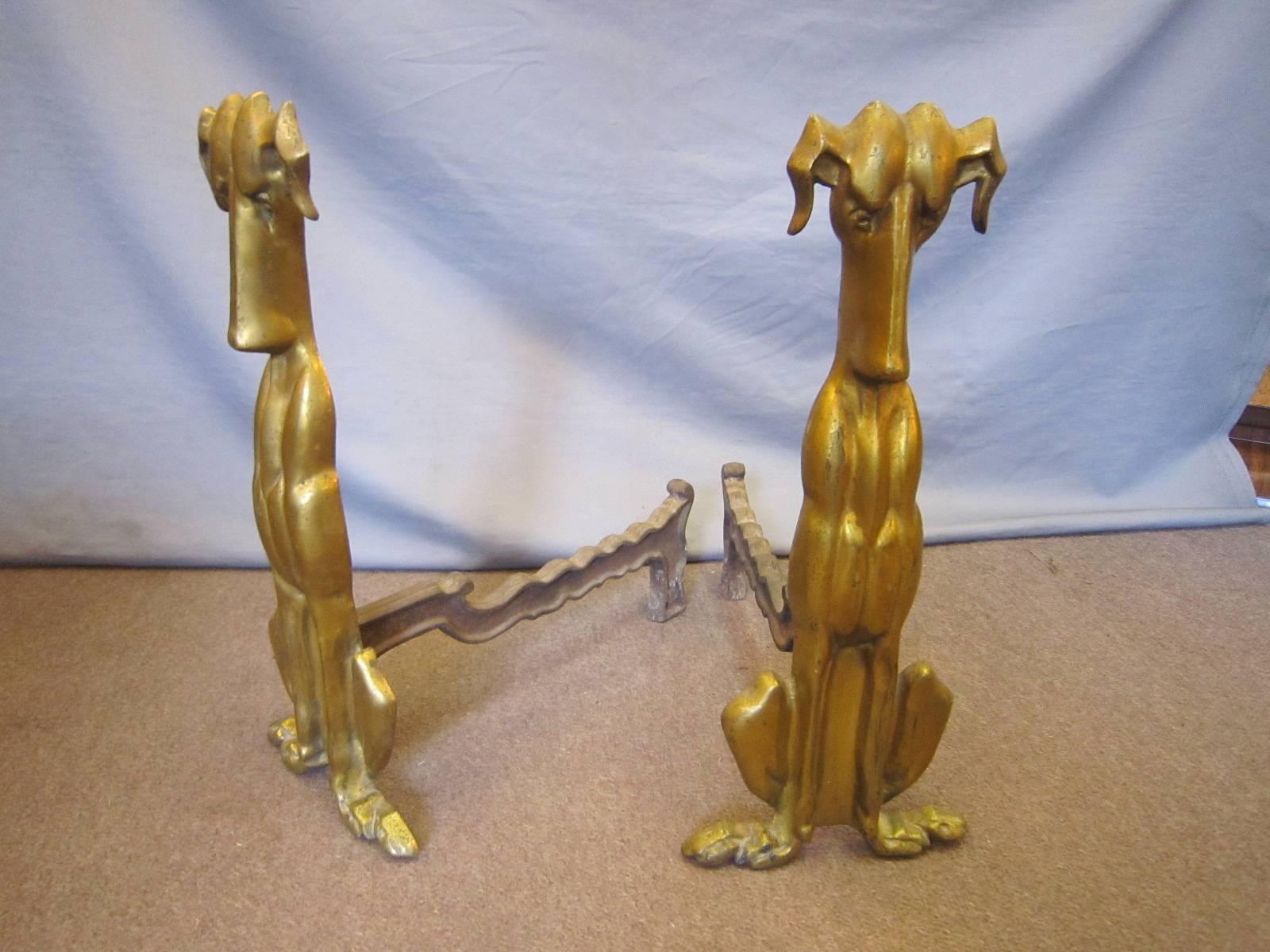 A pair of Art Deco bronze and iron dog andirons or log holder. 
Can even be used as a magazine rack.
Stamped: Tennessee chrome plating company
Original gilt patination, some surface wear and small spots commensurate with age and use.
 