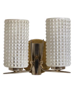 A vintage 1960's enameled glass, brass and nickel two light wall sconce