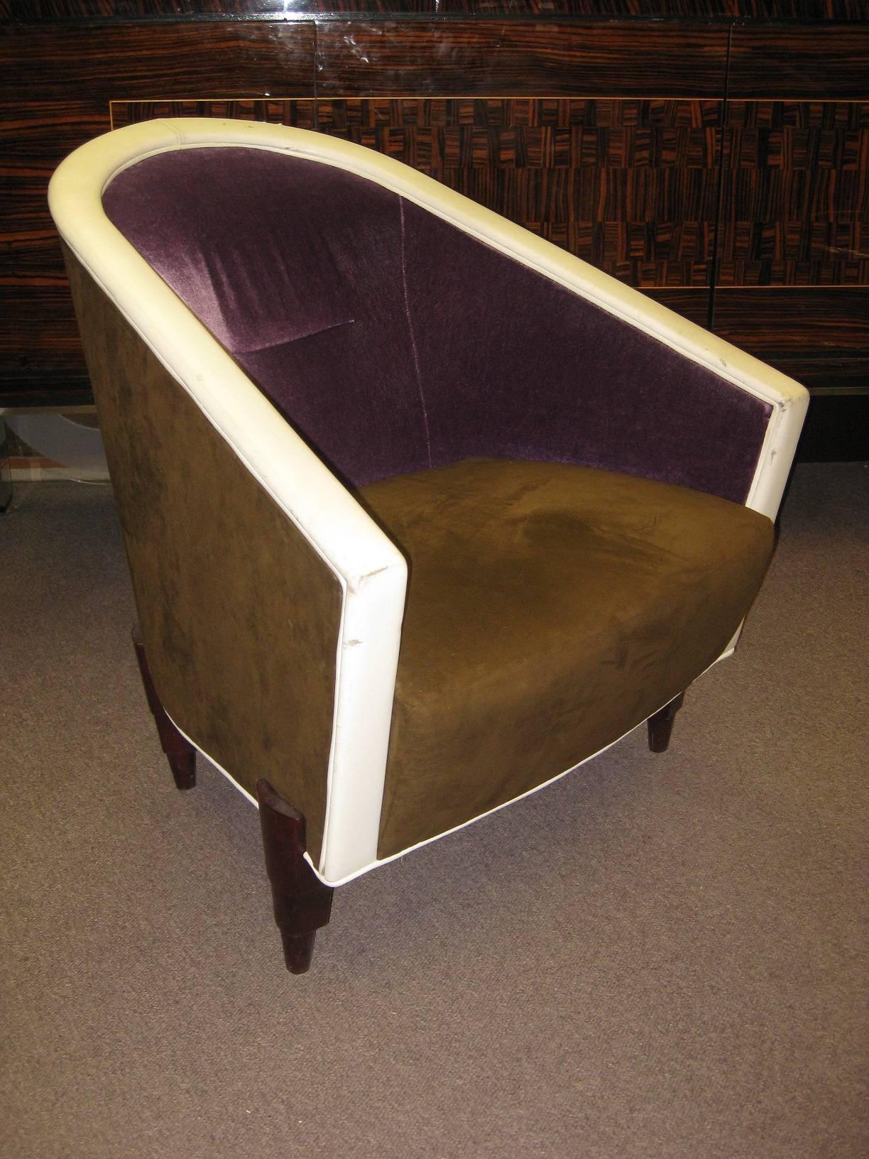 Pair or one club chairs, extremely comfortable. Streamlined form, upholstered in purple aubergine mohair and mocha suede and raised on stepped wood legs.
Italian, by Colber International, from a French hotel near the Champs- Elysees.
Price is per