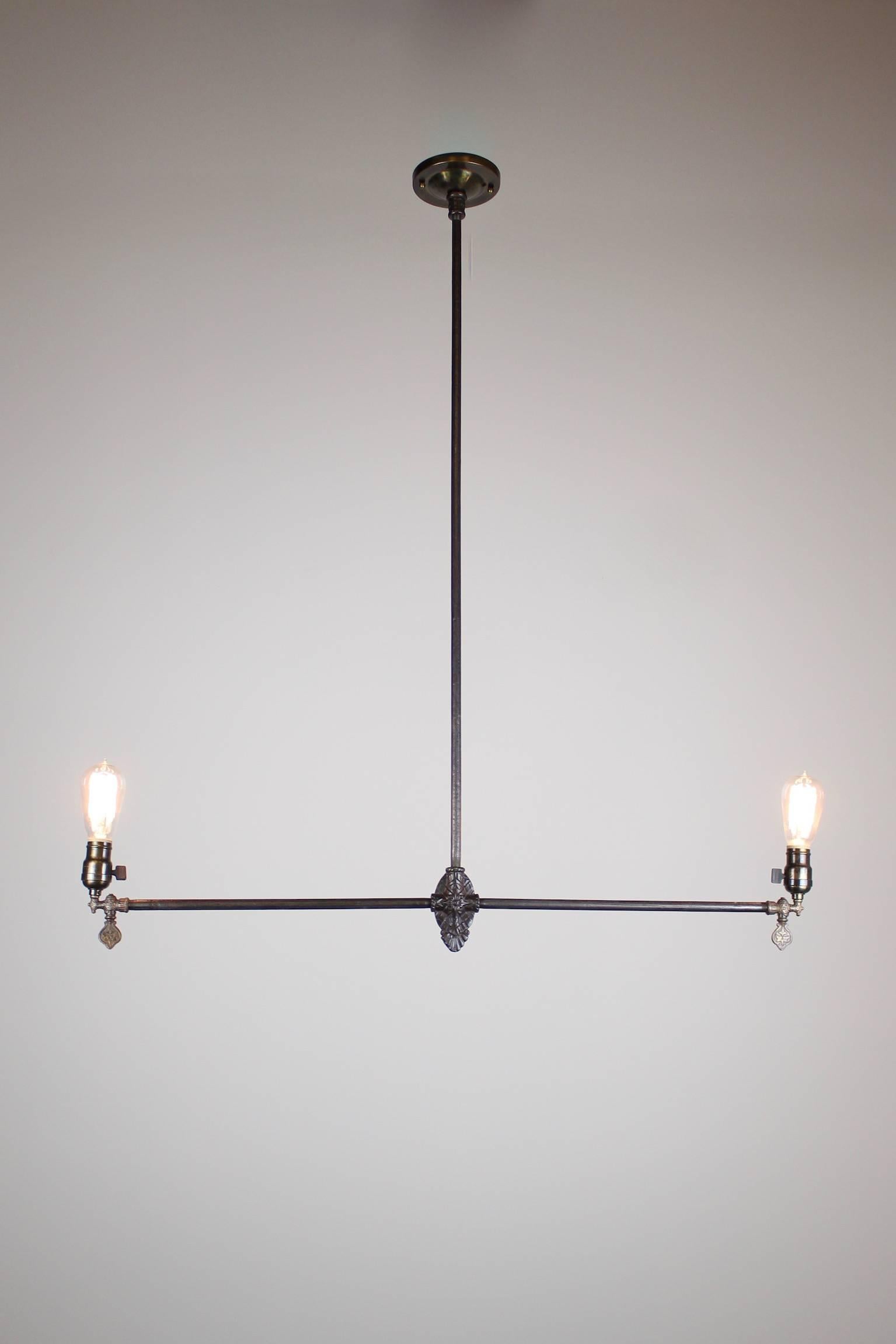 All original American Industrial gas light fixture, attributed to Archer & Pancoast of New York City, circa 1885. These lights were typically found in warehouses, commercial windows, factories, etc. This particular light is in a warm expresso