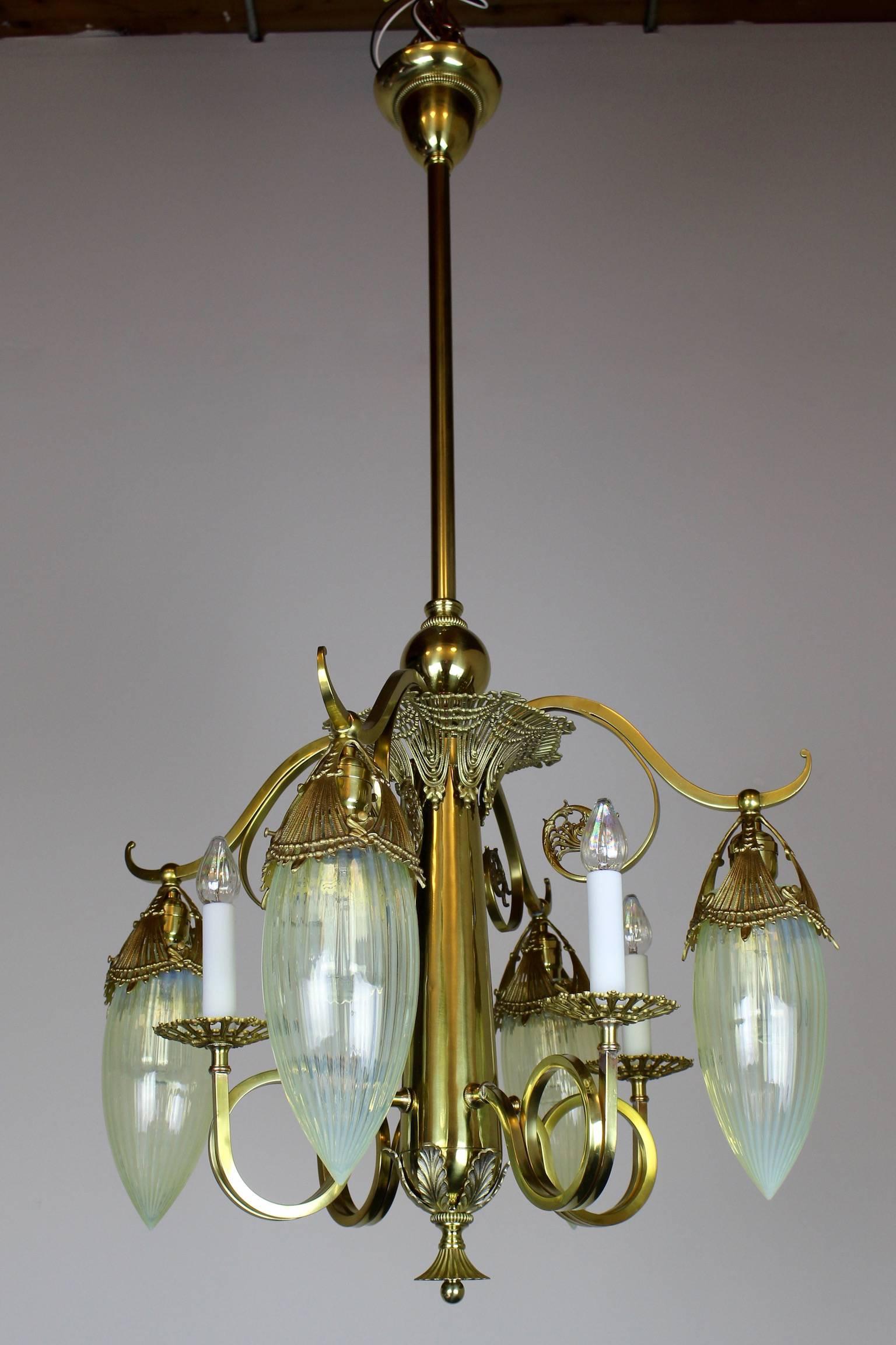 This converted gas-electric chandelier embodies true "Empire" style in its airy design, asymmetrical lines, with a clear French influence. Restored to its original golden satin finish, this light has been brought back to its original