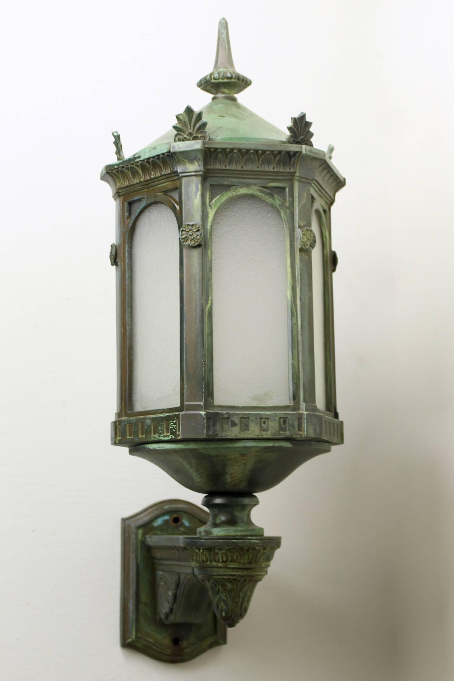 This is an absolutely superb pair of bronze neoclassical sconces with a Verdigris finish, circa 1905. They have been fully disassembled, cleaned, rewired and restored to their original splendour. Perfect for the exterior of a large home or