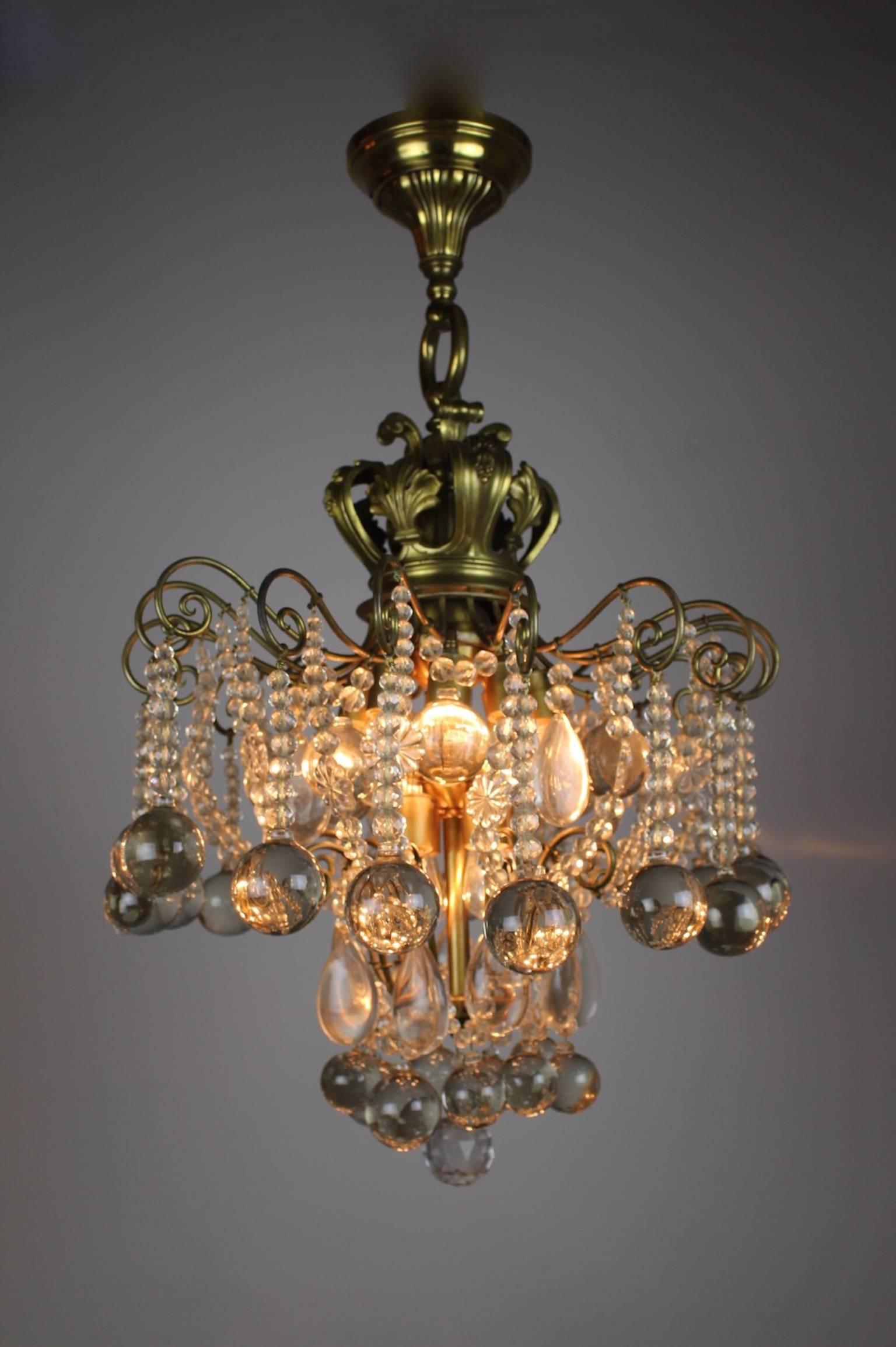 This is a stunning crystal chandelier fixture by E. F. Caldwell of New York City, circa 1910. Fully restored and in excellent condition, this light was originally installed in British Columbia Parliament building in Victoria, Canada in 1910.
