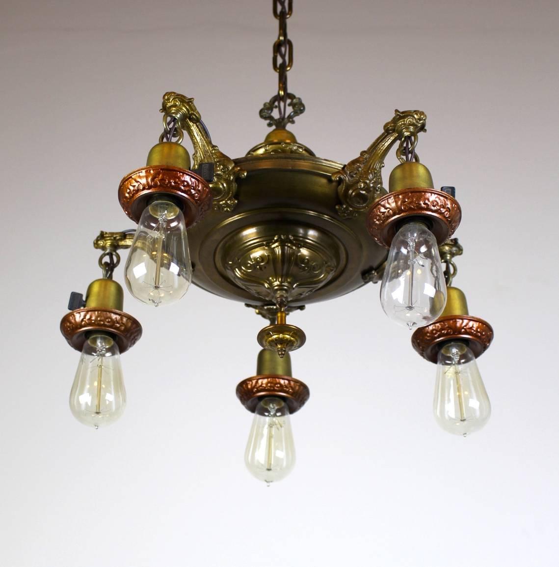 Nicely embossed five-light pan fixture with a lacquered old brass finish.

Restored to original condition, with rouged decorative bulb surrounds.

circa 1925

Measures: 38