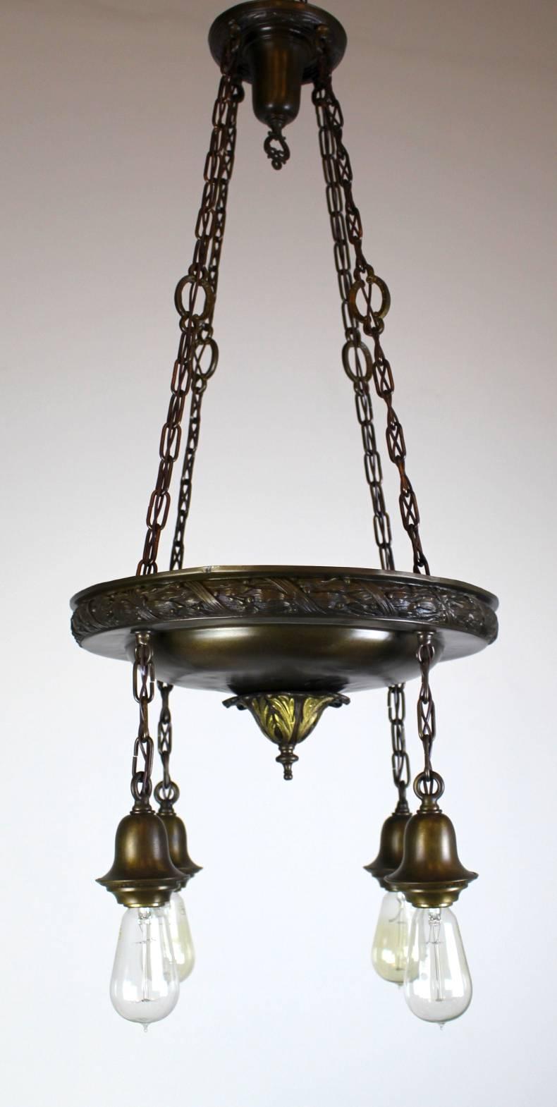 Lovely shower fixture with bare Edison bulbs.

Large body fixture with Laurel wreath design on edging and gold leaves in centre.

Four lights. Finished in a dark chocolate brass.

Measures: 41