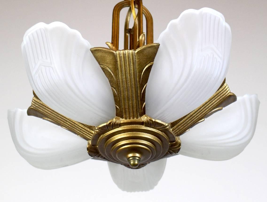 Charming five-light Art Deco drop fixture.

Gold painted finish, very contemporary leaf design on central column, with original shades.

Rewired, restored and ready to hang.

Measure: 33