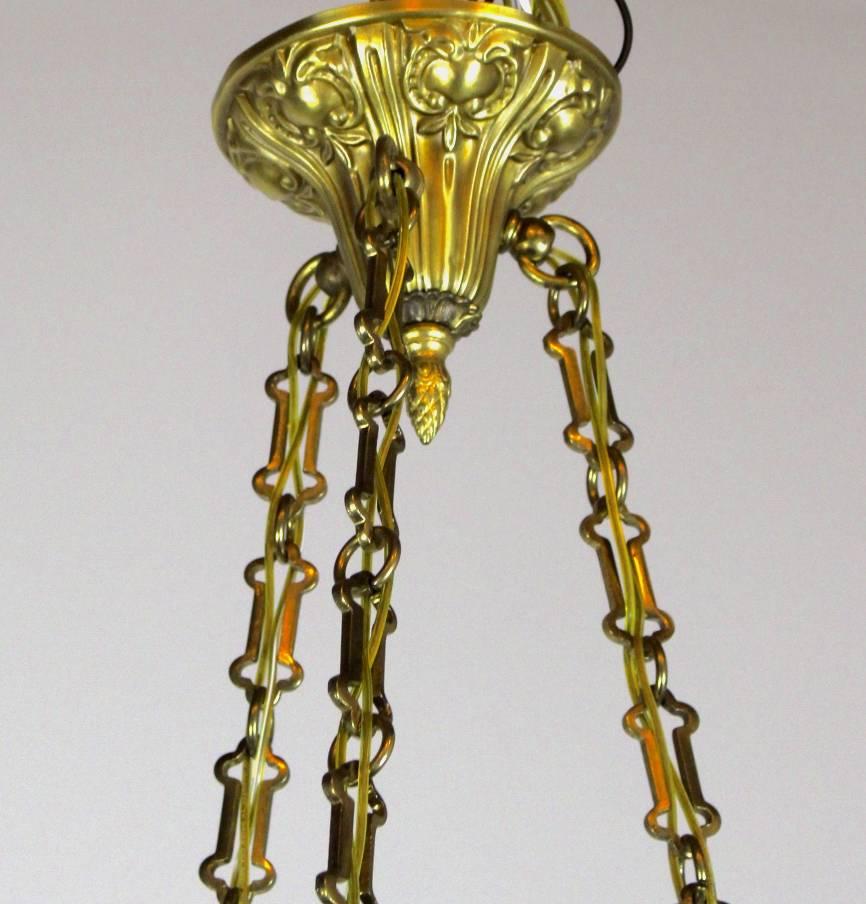 Lovely petite shower fixture finished with crystals.

Decorative chain, and embossed floral motif on the body.

circa 1915.

Measures: 30