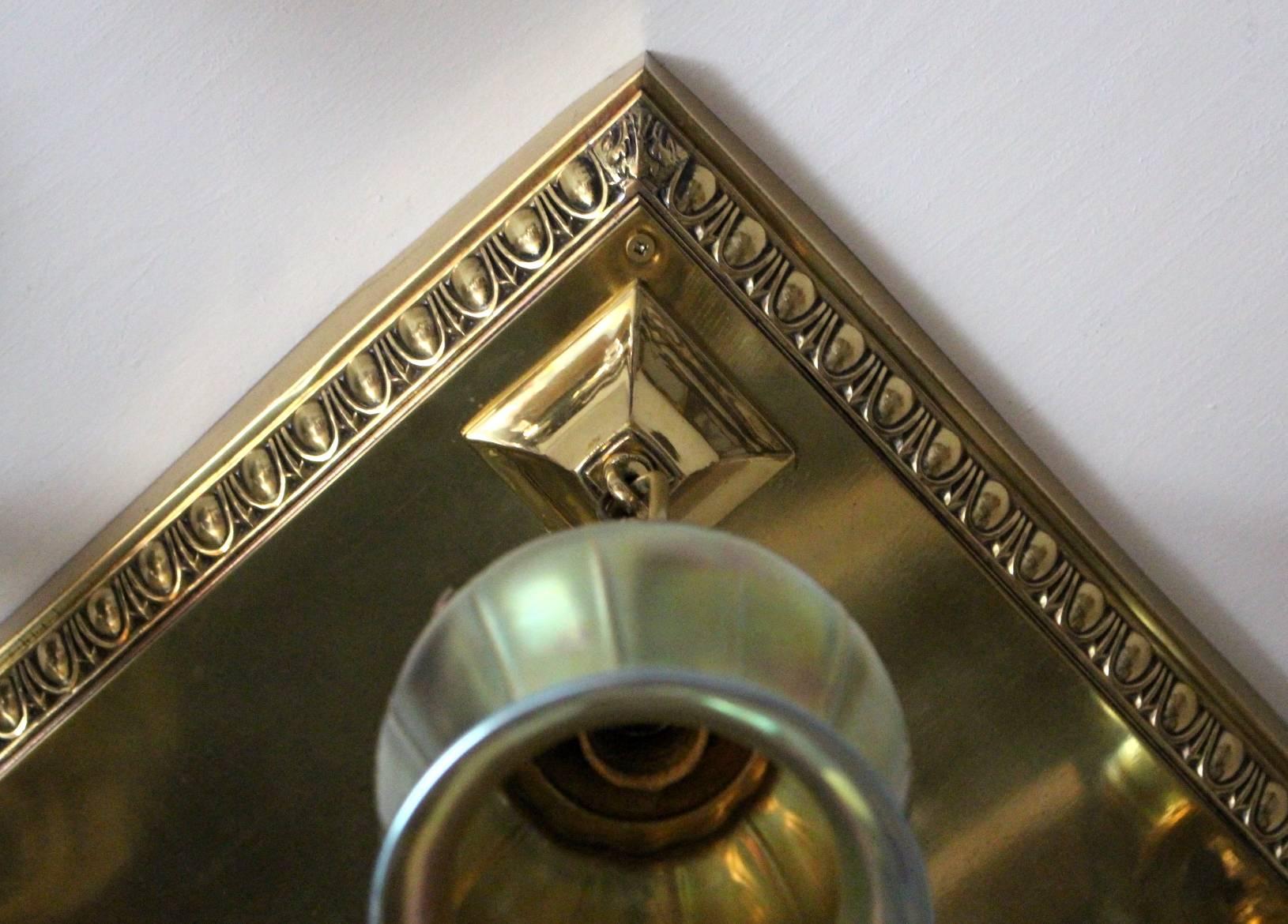 Original polished brass flush mount with antique art glass shades.

Measurements: 19