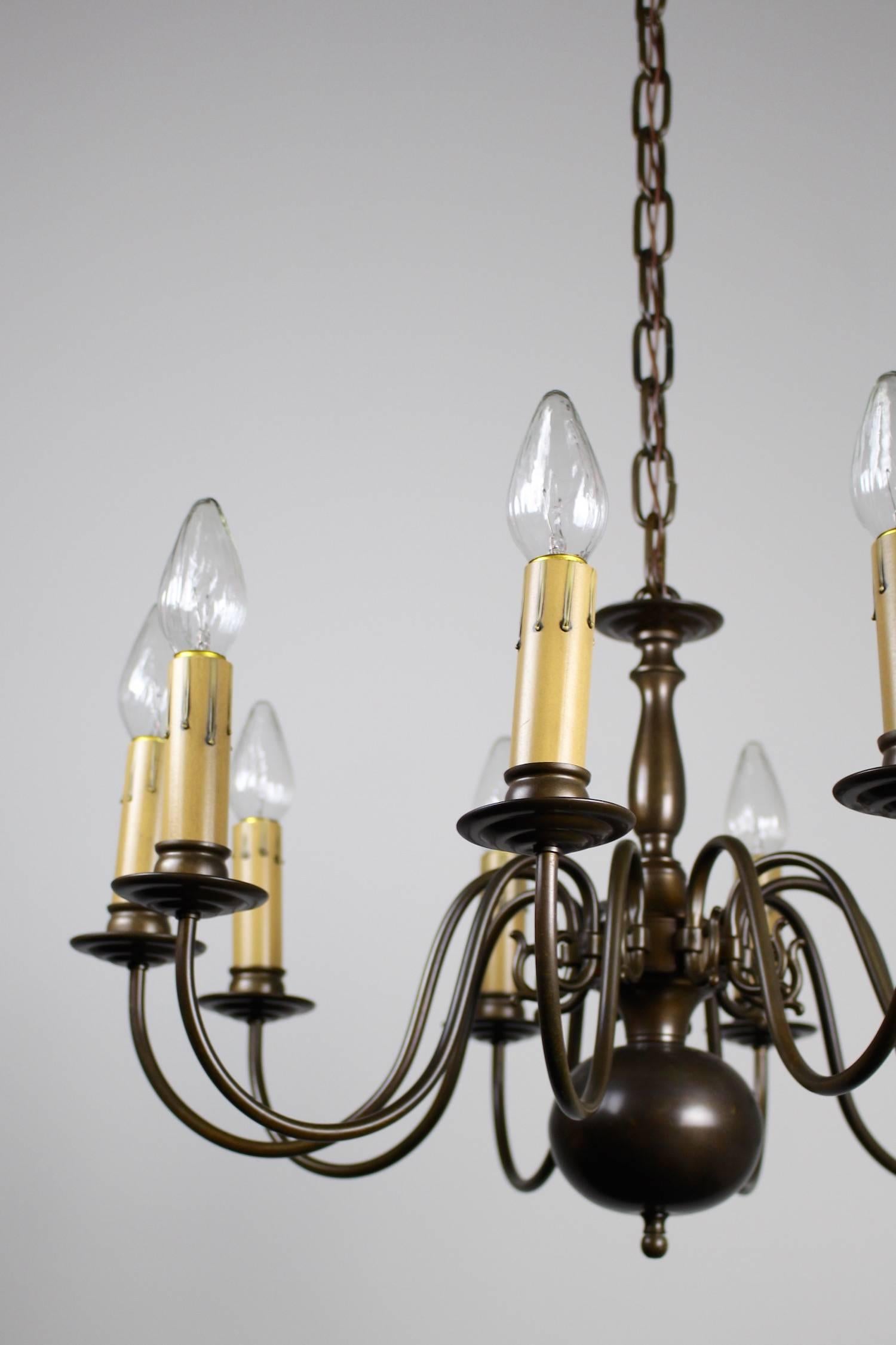 A lovely example of Dutch colonial style lighting, circa 1940s. This fixture is has been cleaned, rewired, and restored. Fitted with 'candles'. 

SKU CH1050
Measurements: 41" L x 27" W.
(25" Minimum length).