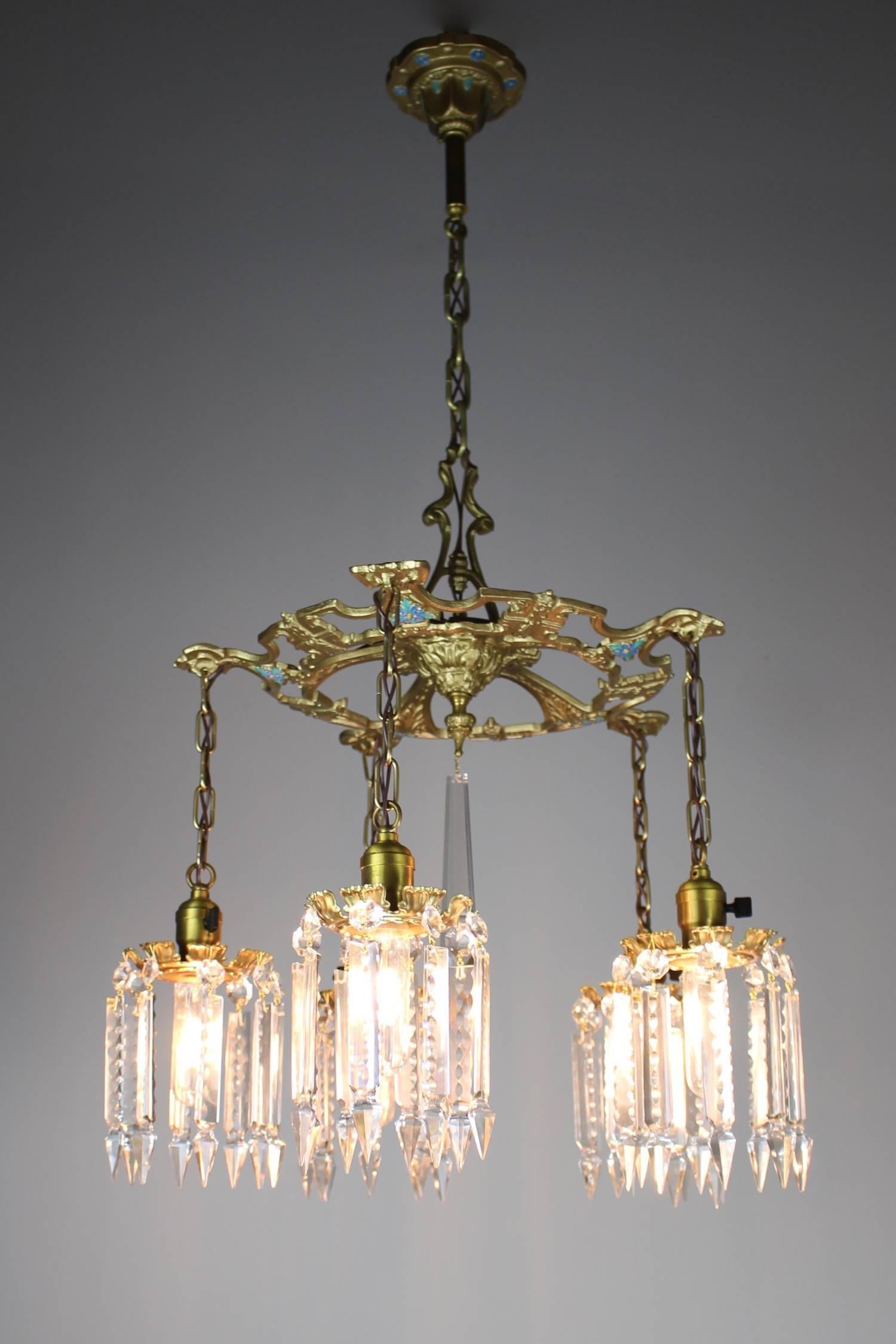 Found in Cleveland, Ohio, circa 1918. This lovely five-light Edwardian fixture is made of cast iron and painted gold. Fitted with cut crystal it makes for an airy yet substantial light - perfect for a dining room or entry way. This light has been