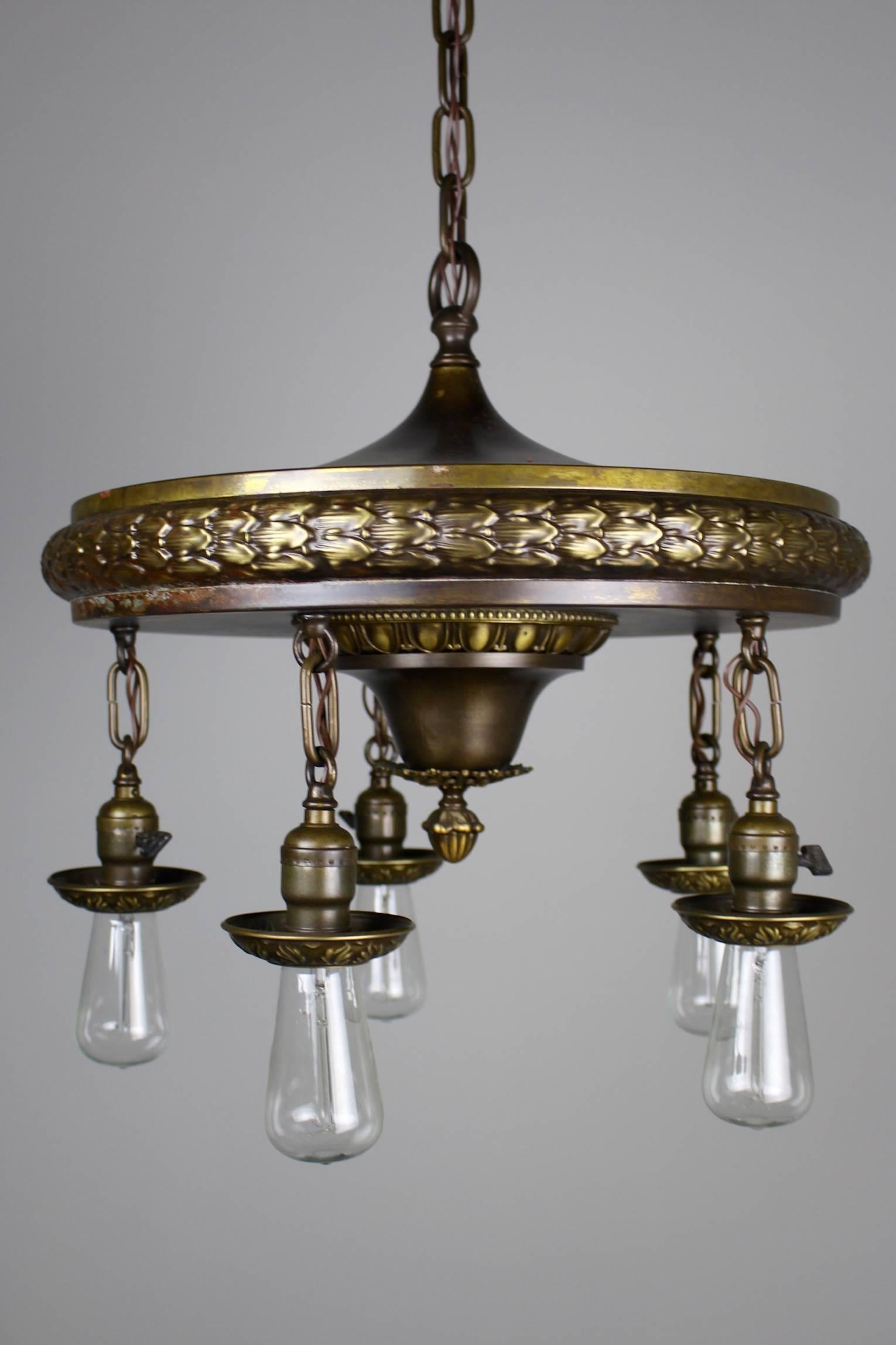 Circa 1920s This dining room fixture is done in the style of Neoclassical Revival using the acanthus leaf pattern, egg & dart pattern, and wreath as design elements. this light has been cleaned, rewired, and restored. Fitted with Edoson bulbs