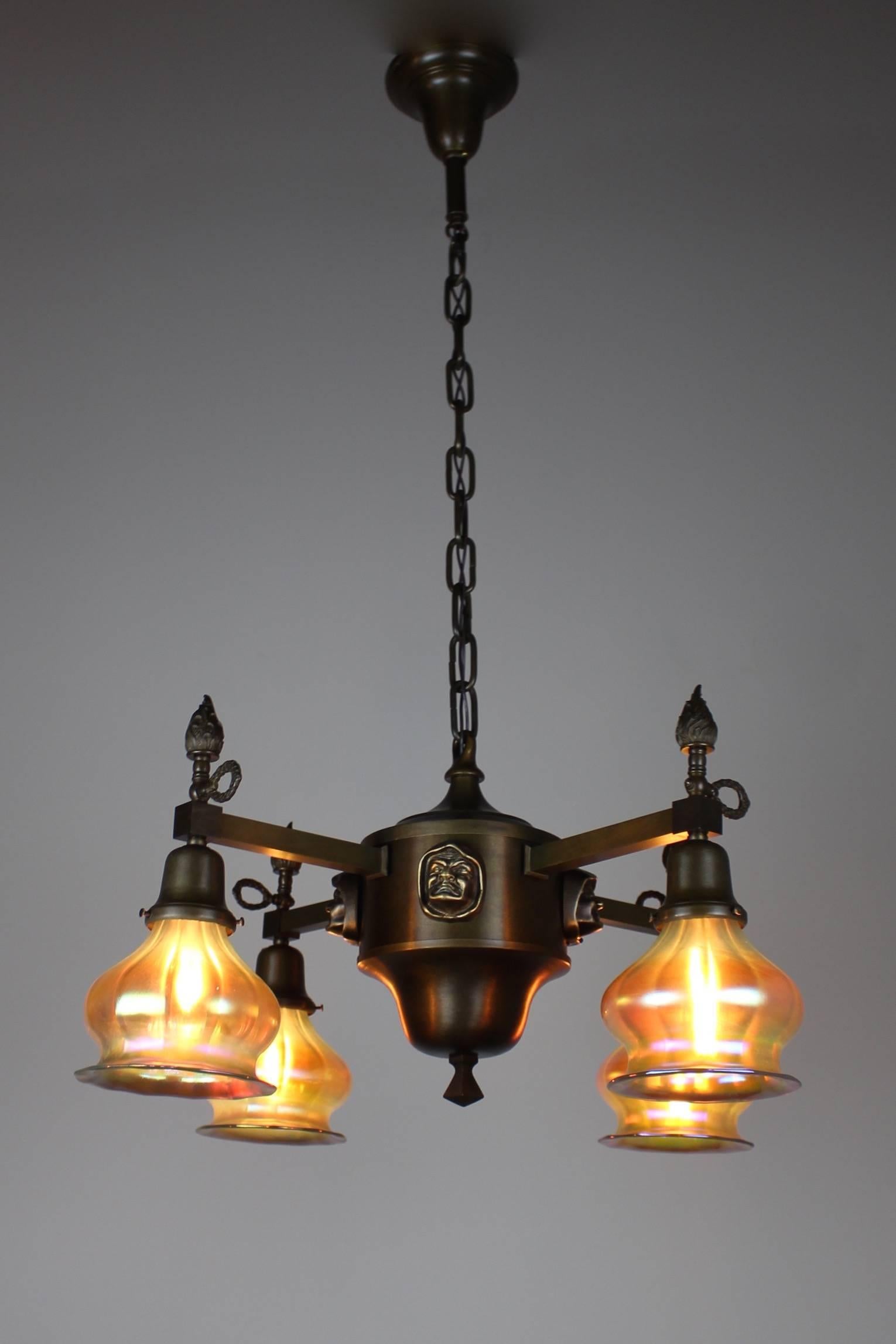 An fantastic Arts & Crafts light, originally sourced in New Westminister, BC. Attributed to Bauer of Philadelphia, circa 1905. This fixture has been composed with a beautiful and somewhat Avant Garde Silhouette and 'monk head' figural motif,