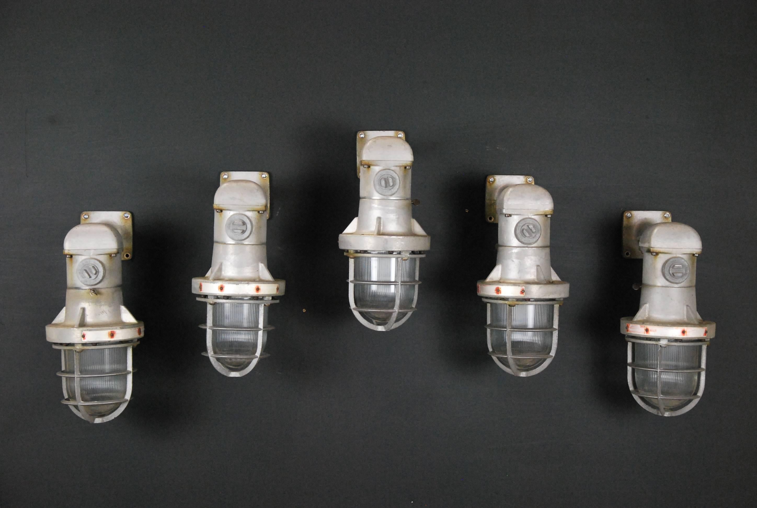 Large Industrial wall sconces, manufactured by Rab Electric Mfg. (founded in 1945). Re-wired and CSA approved. Quantity of five. Price per light.
 