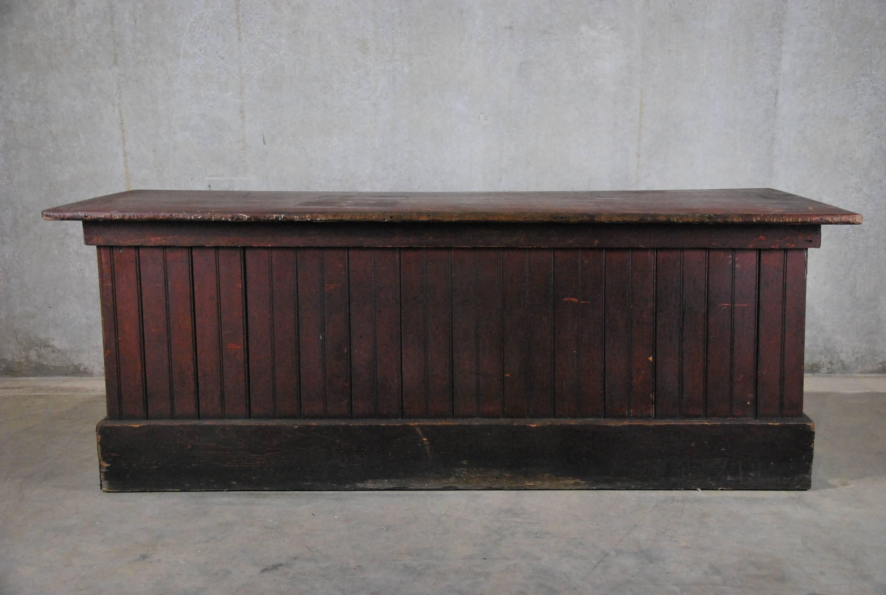 Solid fir counter salvaged in the Pacific North West in original old oxidized red paint. 
Some restoration can be completed in house.

  