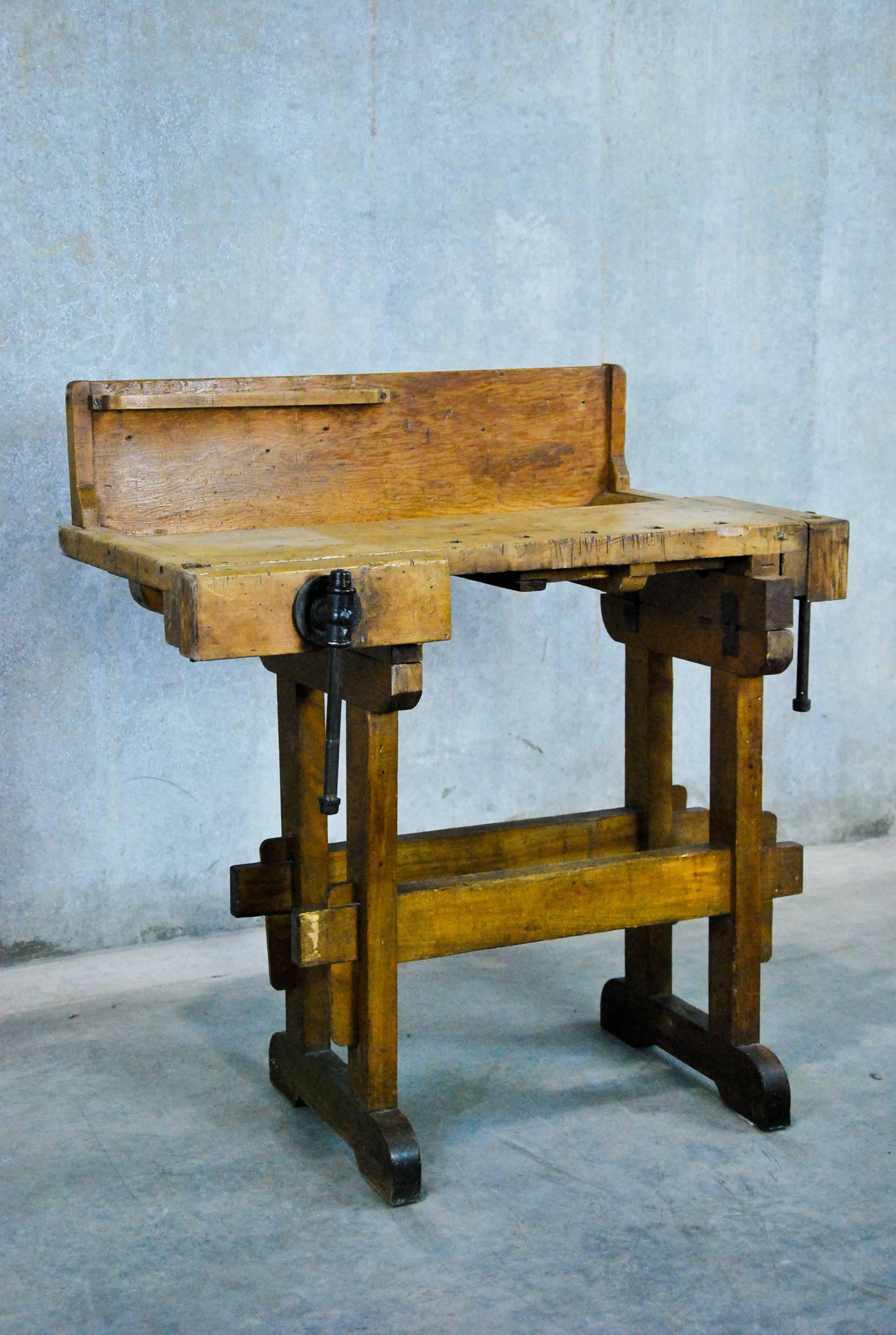 Very unusual solid wood carpenter's bench found in a factory in Eastern Canada.
The patina is untouched with full working vices. This unusual small size would make a great side table or serving bar.
Industrial, rustic, Classic style, console