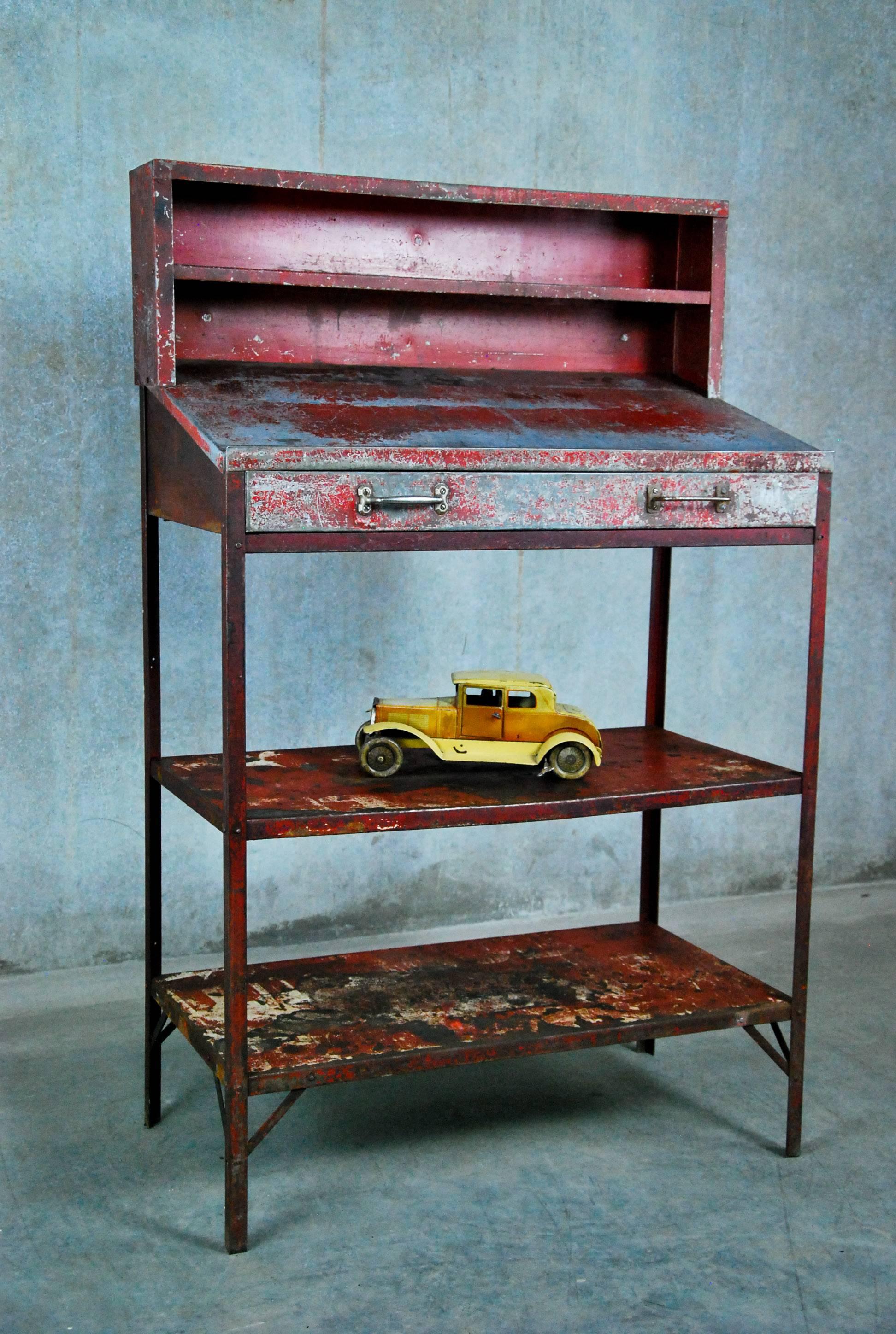 Great paint on this original factory foreman's desk. Lightweight, with multiple shelves,  it makes a great catch all or hostess stand. Found in a factory outside Buffalo.