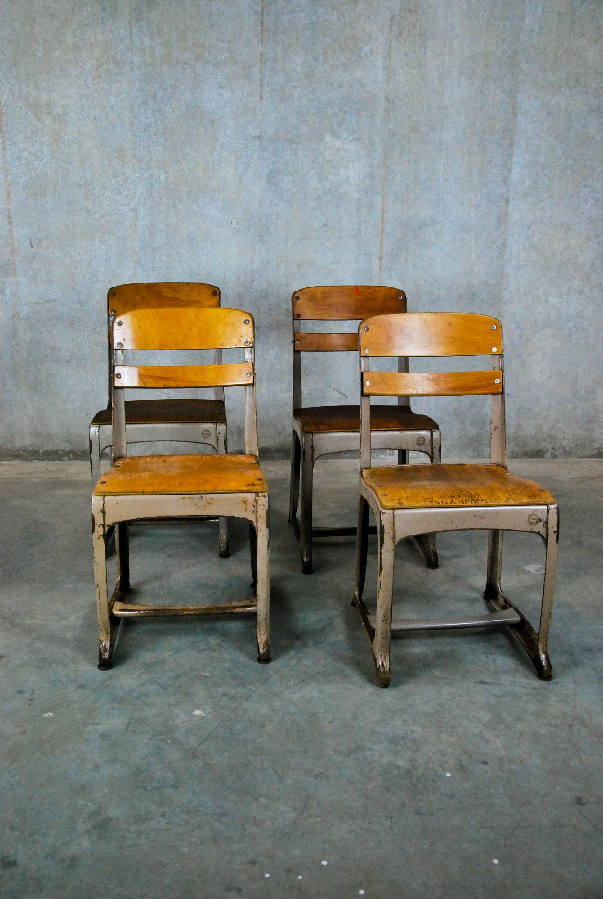 1920
American seating company of Grand Rapids, Michigan, model 368, ergonomic envoy classroom chairs , made of pressed steel with molded plywood seats and backs - complete with adjusting lower rail and leveling feet.
 Sturdy and extremely