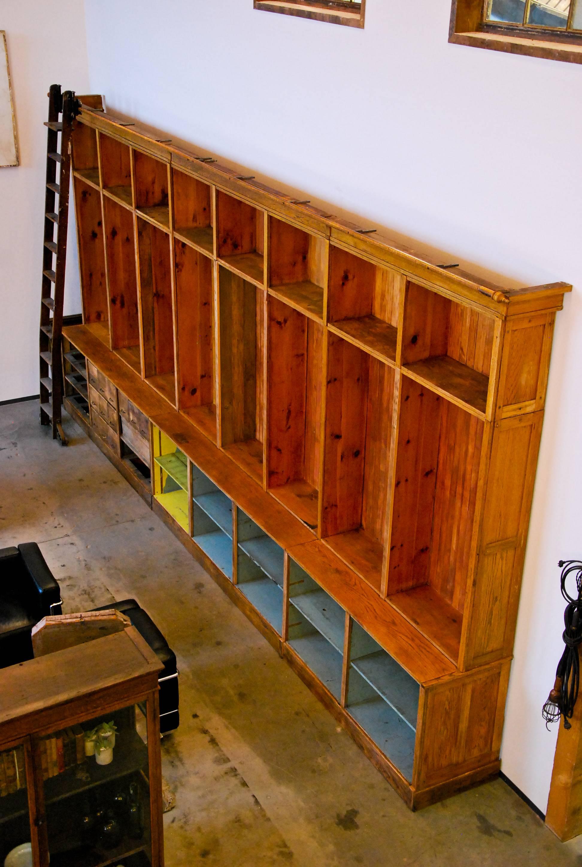 1920 Mercantile Hardware Store Retail Cabinet with Rolling Ladder In Good Condition In Surrey, BC