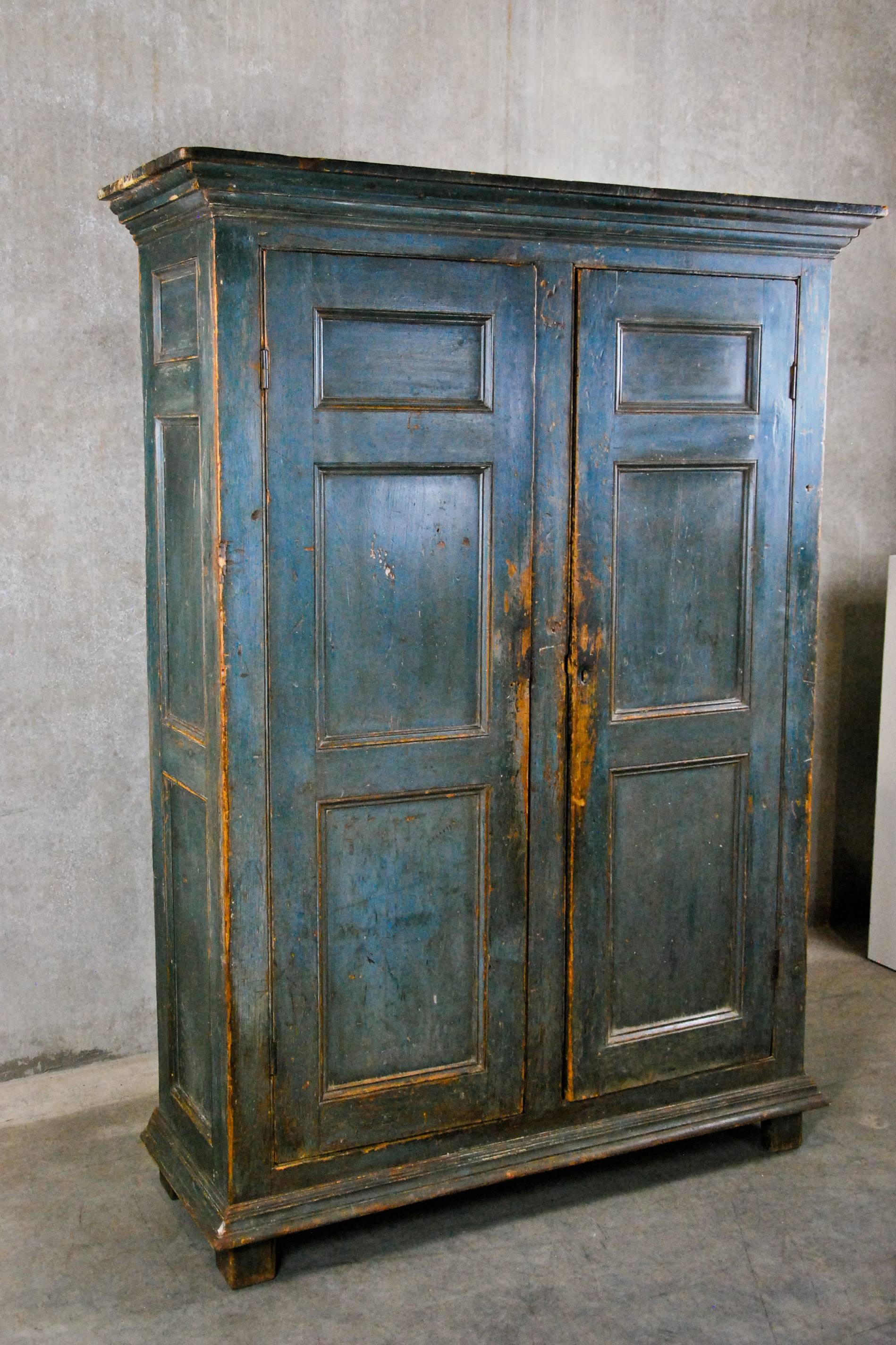 A rare untouched Quebec armoire in old surface. This polychrome finish is an oxidized grey/blue over blue. The shelves are original and are clean inside.
This piece has a working key to lock the cabinet. Found recently in Quebec.
Canadian at its