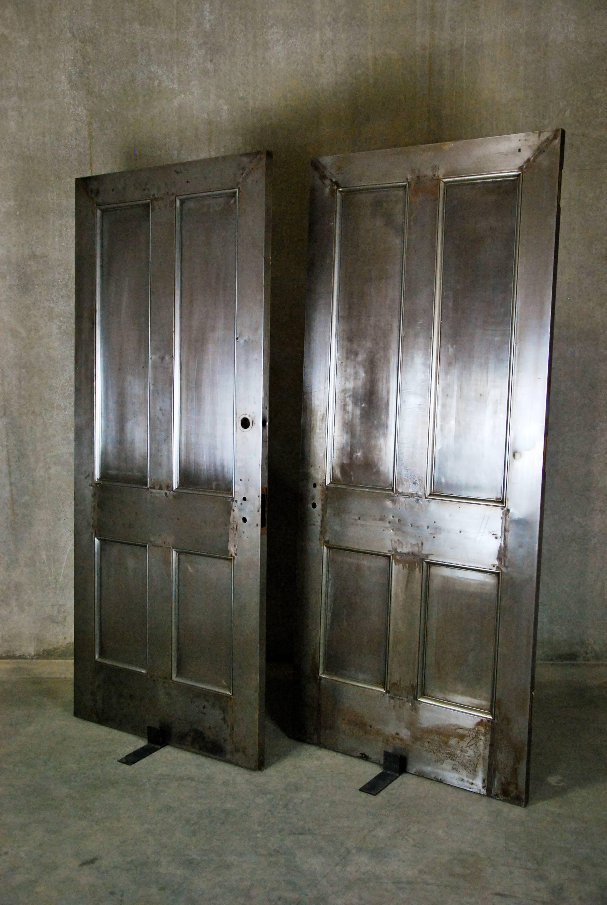 We have several versions of interior, industrial-style steel doors salvaged from the historic Smith Tower in Seattle. The four-panelled pair, shown, have been hand stripped and polished to a nice patina.

 