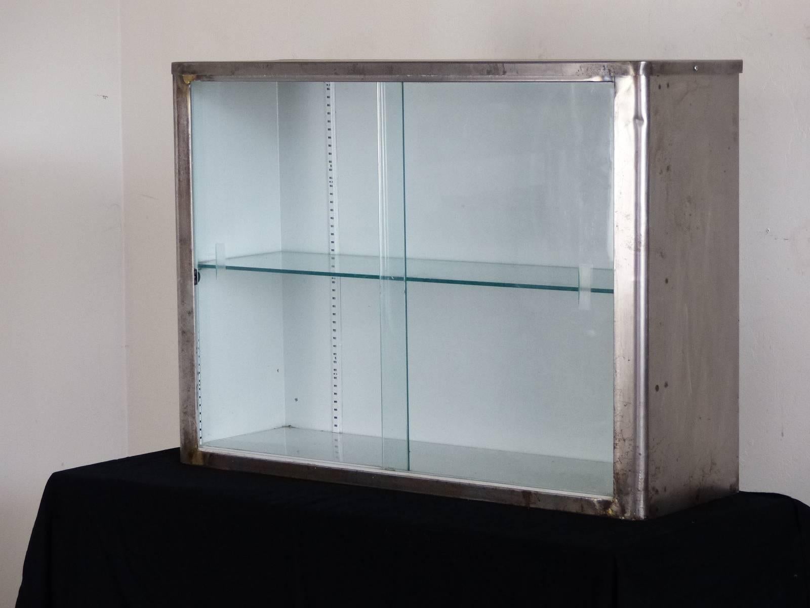 Glass cabinet with single glass shelf. From a drug store in Toronto circa 1940