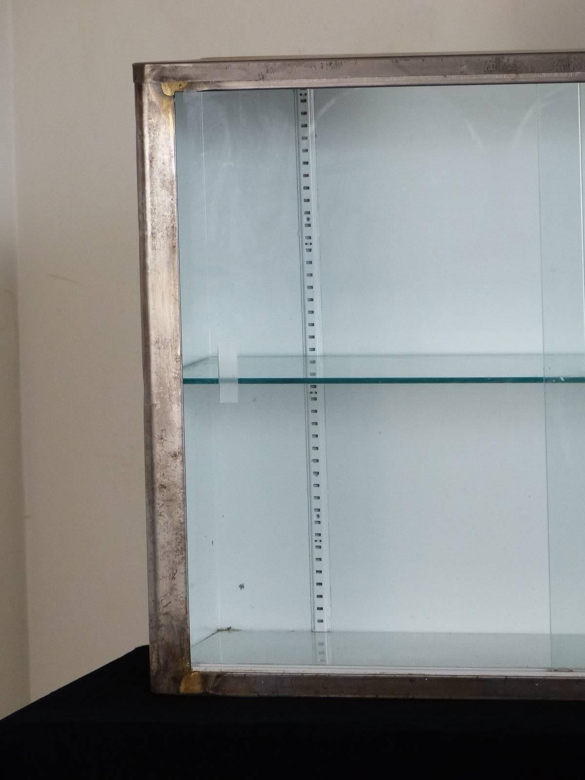 metal and glass wall cabinet