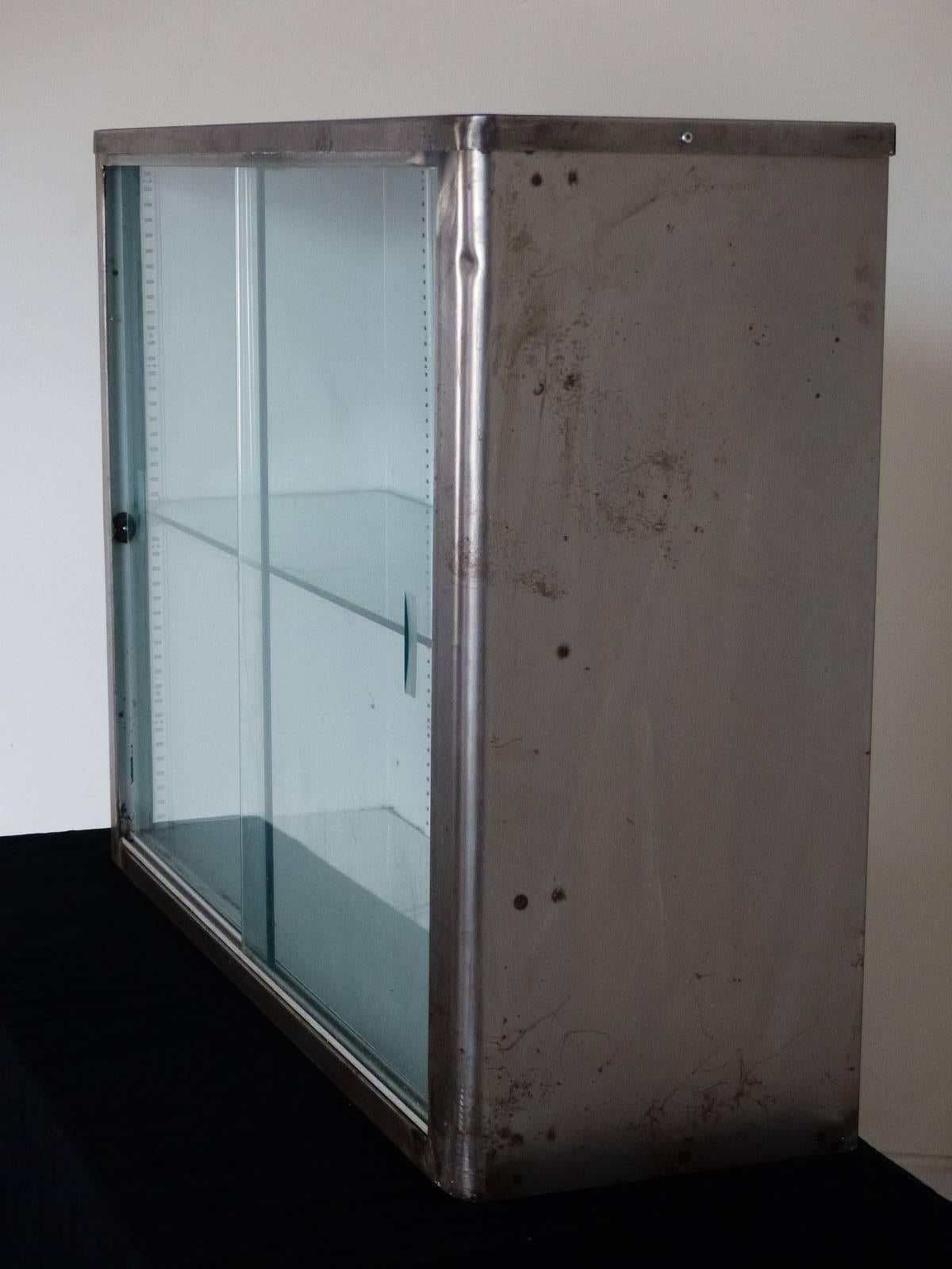 metal wall cabinet with glass doors