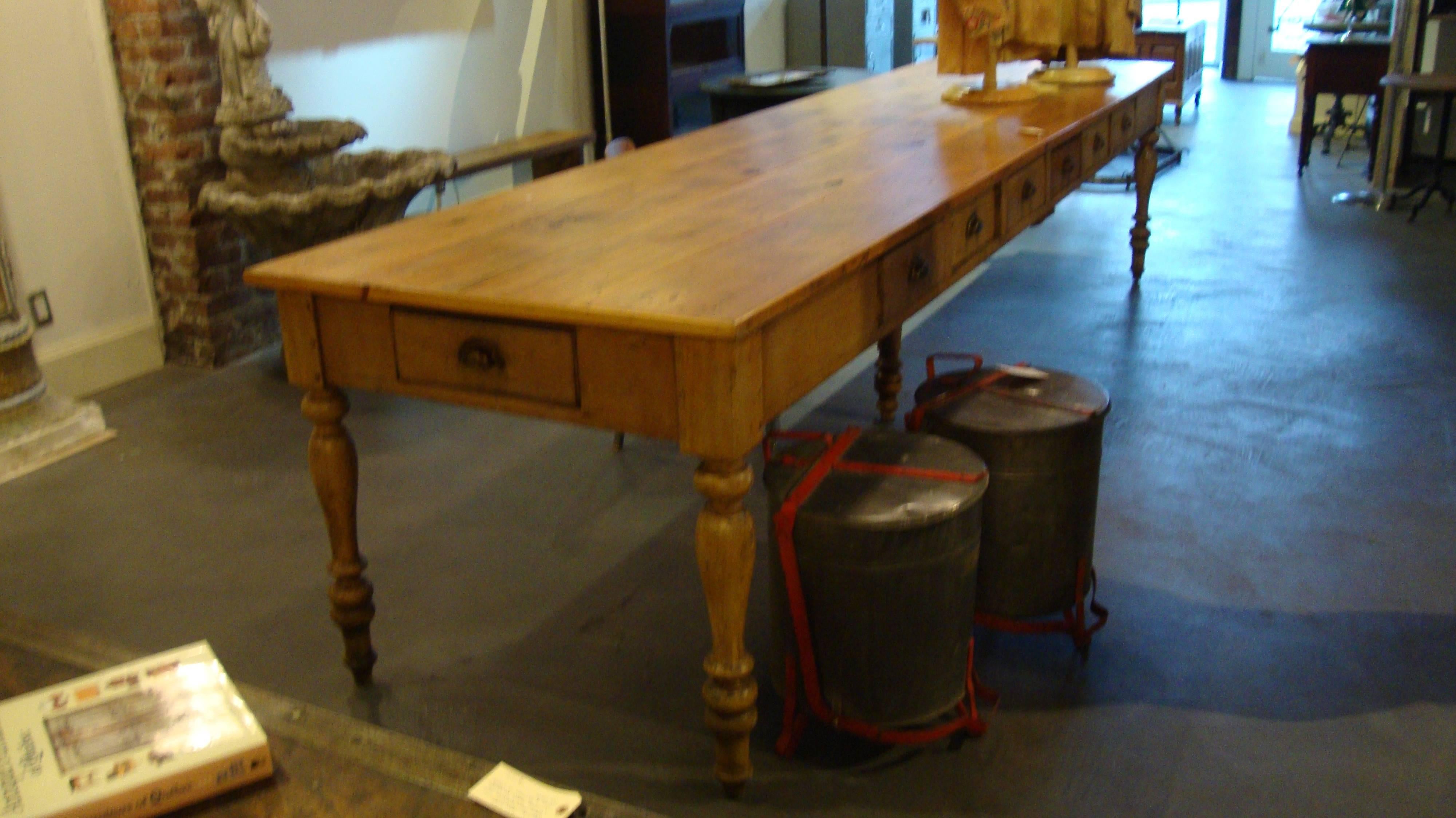 Very nice Quebec multi drawer pine convent table in full 10 ft lengths with 4 board original top.
The overall height of 31.5 x 36 wide . These tables were used mostly in convents for dining with a drawer being assigned to individual users.