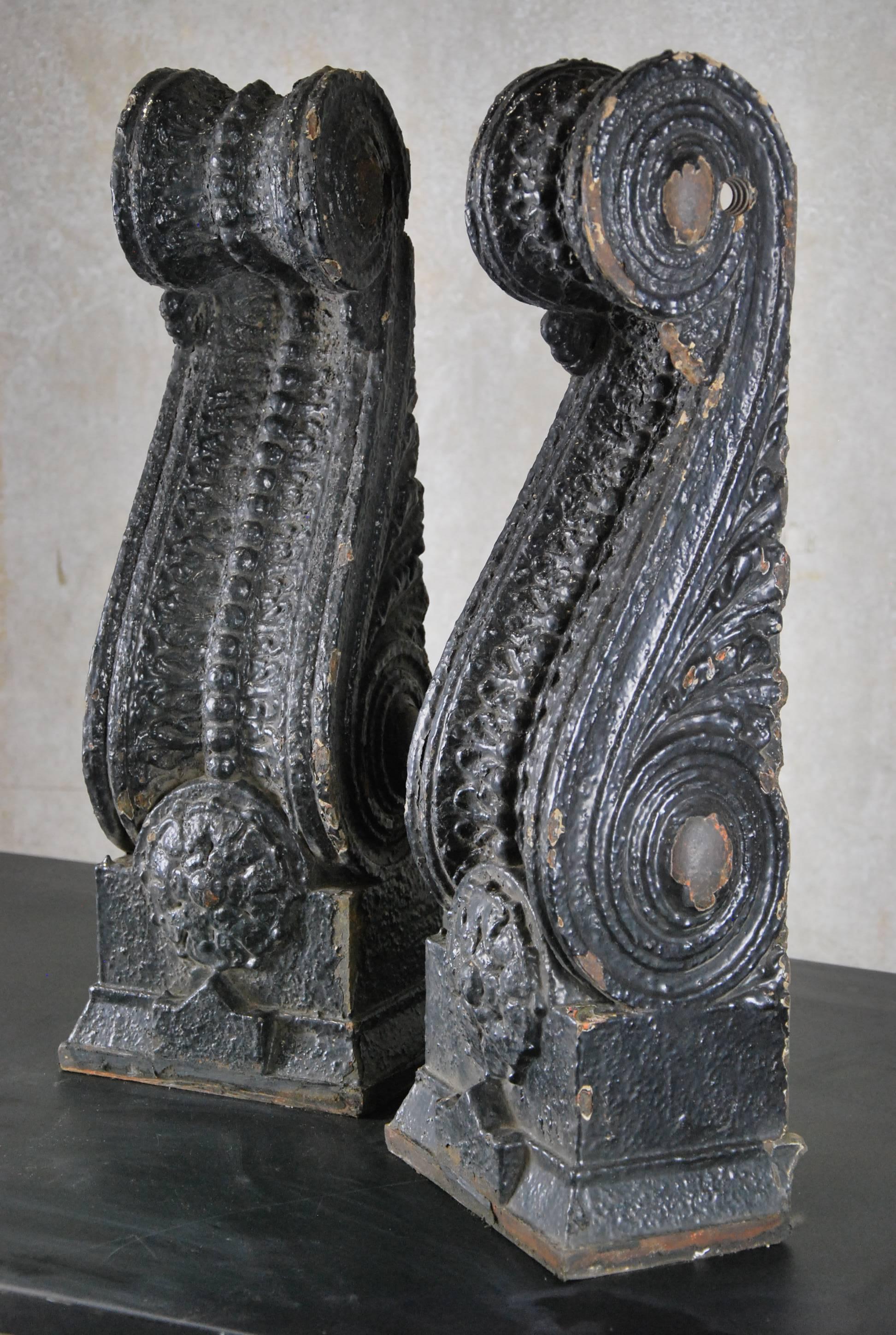 A pair of all original and unrestored American exterior ornamental cast iron building facade corbel, salvaged in Chicago designed by the architectural firm of Frost and granger in 1904.
The oversized neoclassical style cast iron corbel contains