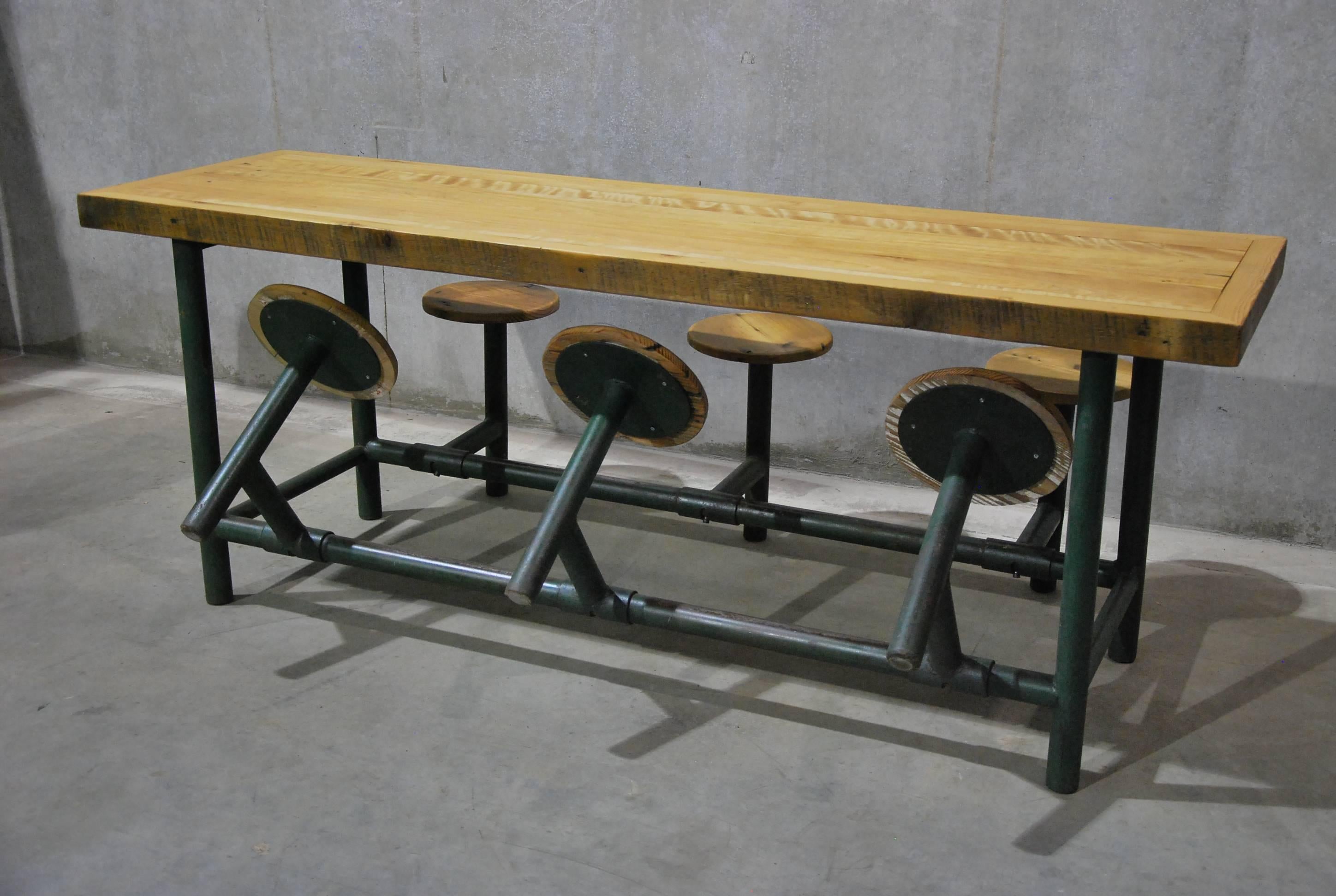 Great solid six-seat with wooden seats and solid maple top. This antique American Industrial, circa 1930s stationary six-seat factory table was salvaged from told Chicago factory. This unique and Minimalist table is comprised largely of heavy gauge