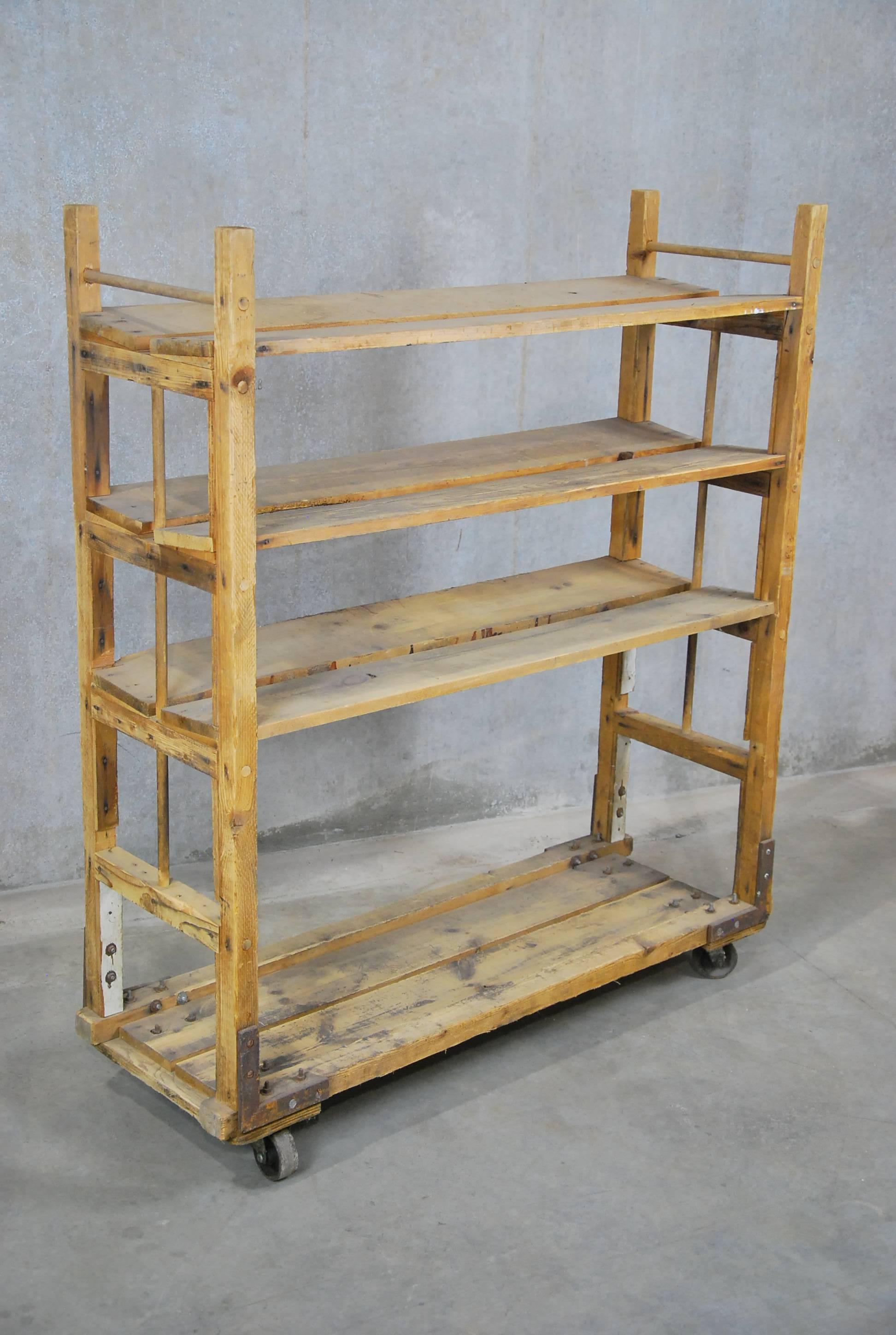 Wooden rolling bread rack with full functional casters and nice solid shelving.
Found in Eastern USA.