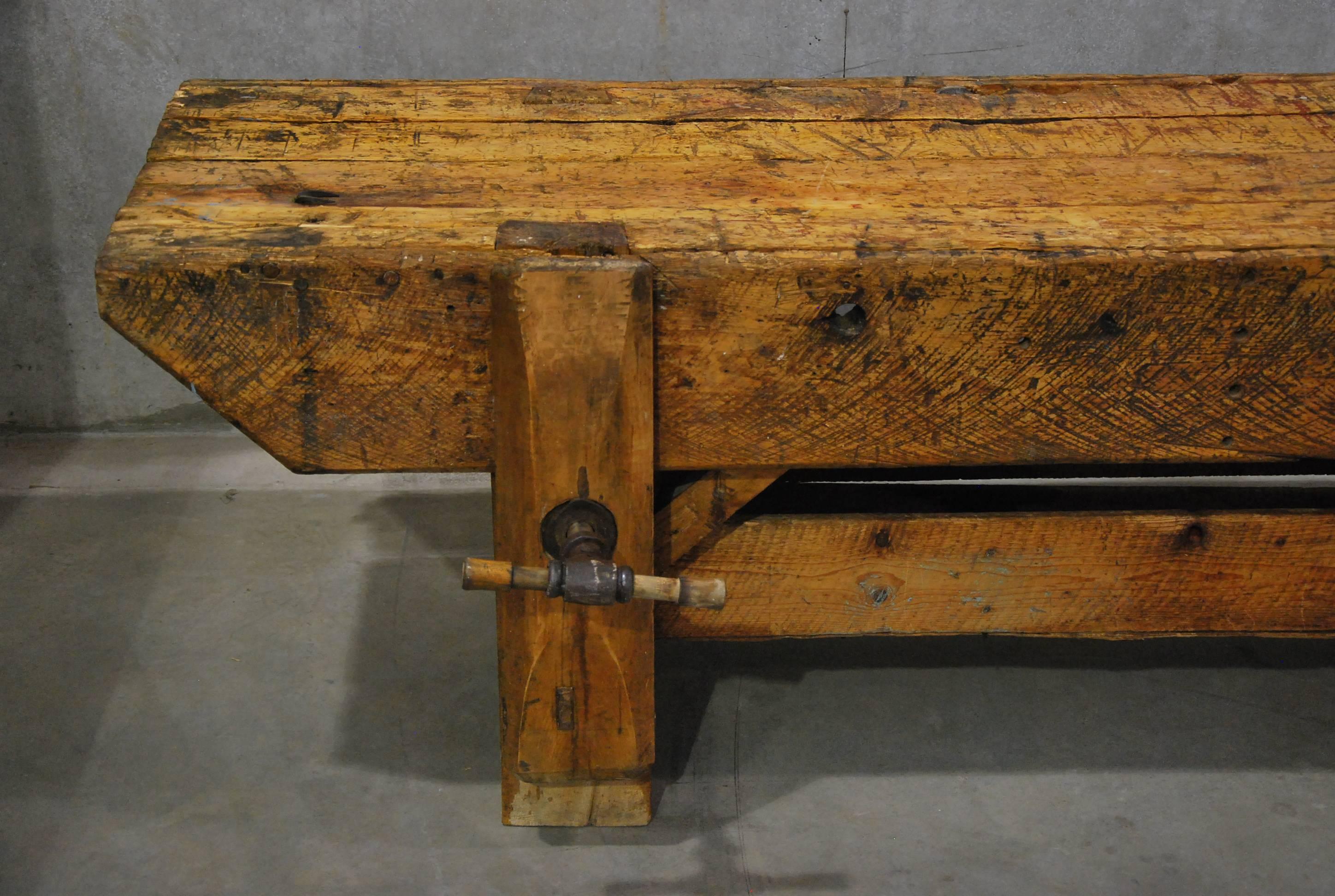 This large Primitive work bench, was once owned by several prominent decoy carvers in rural Quebec. The rough sawn marking in the heavy lumber are prominent throughout . 

This is a great console or serving station for a large area.
 