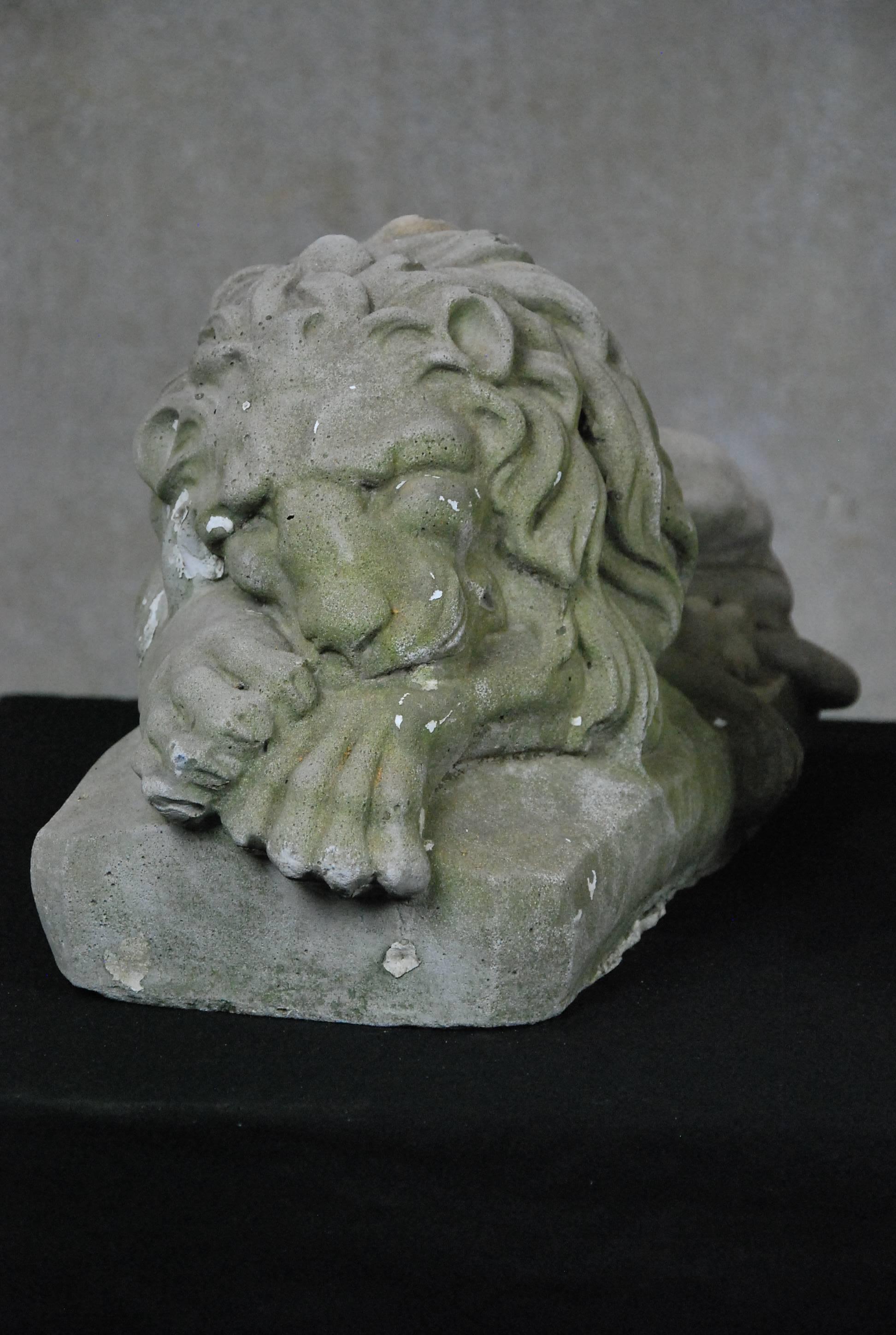 A pair of cast lions salvaged from an early home in Mid West USA.

Some traces of old paint remain.
