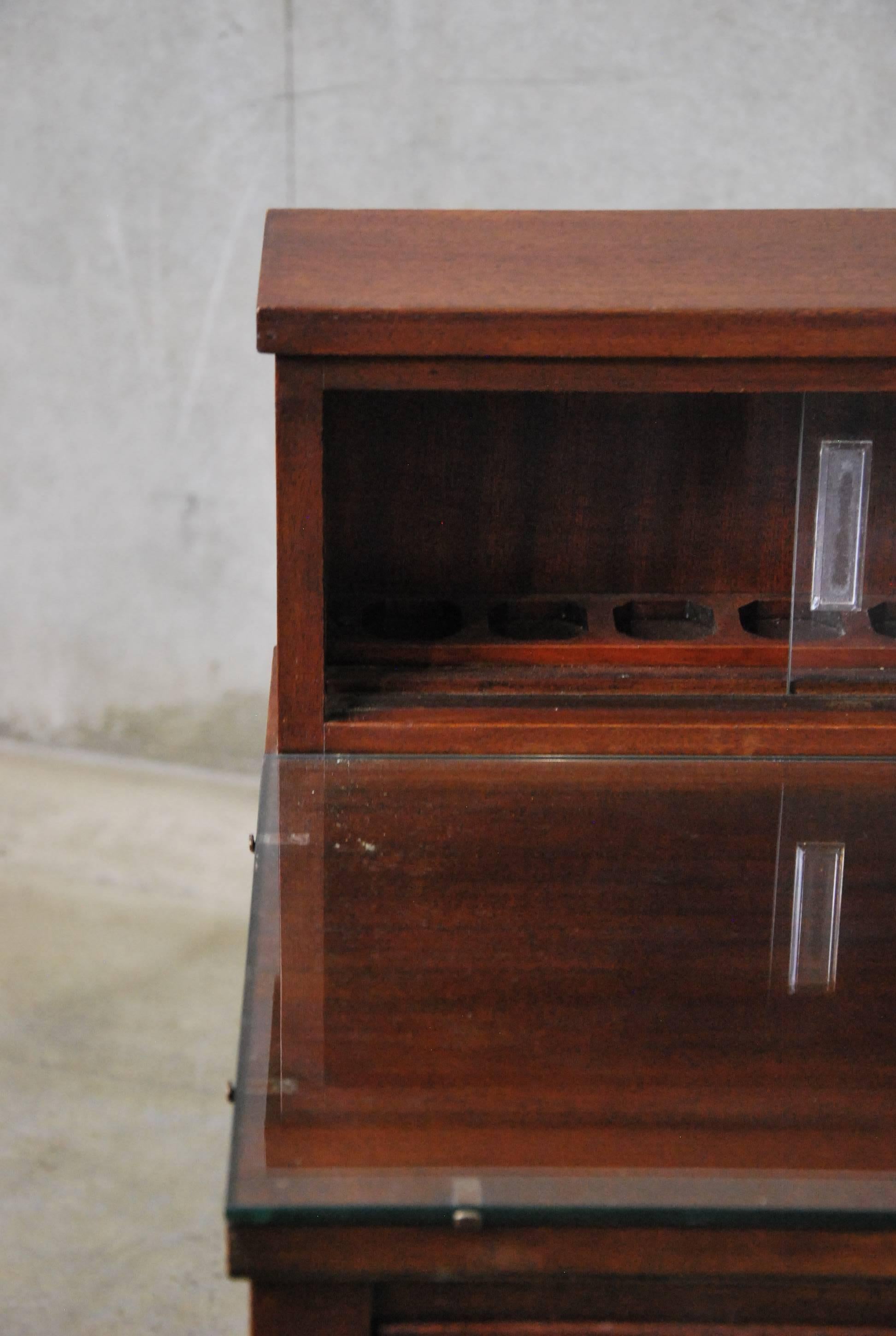 Very unusually small dental cabinet, dated 1930 and found in Southern Ontario. Complete, and in perfect condition, including original, untouched mahogany surfaces. All drawers function and have lined metal interiors. Would make a great bedside