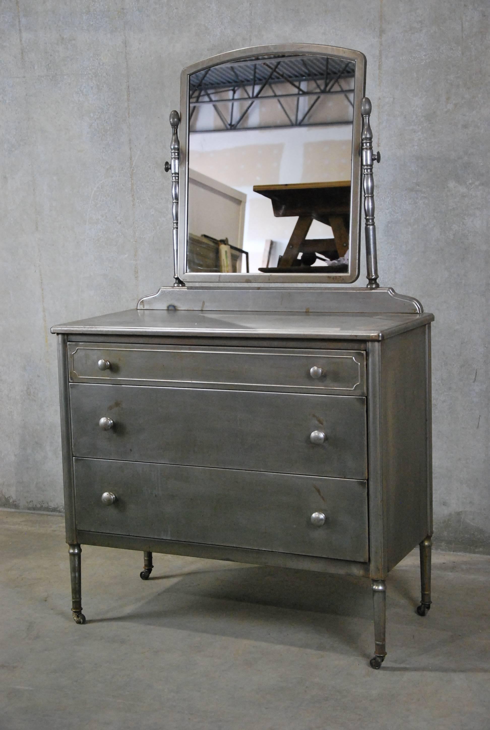 1930 Simmons Low boy dresser refinished by hand and sealed with a wax polish for protection. Fully functional. Found in Chicago.

In 1928 the Simmons Company commissioned Bel Geddes to design metal bedroom furniture that was first sold in 1932.