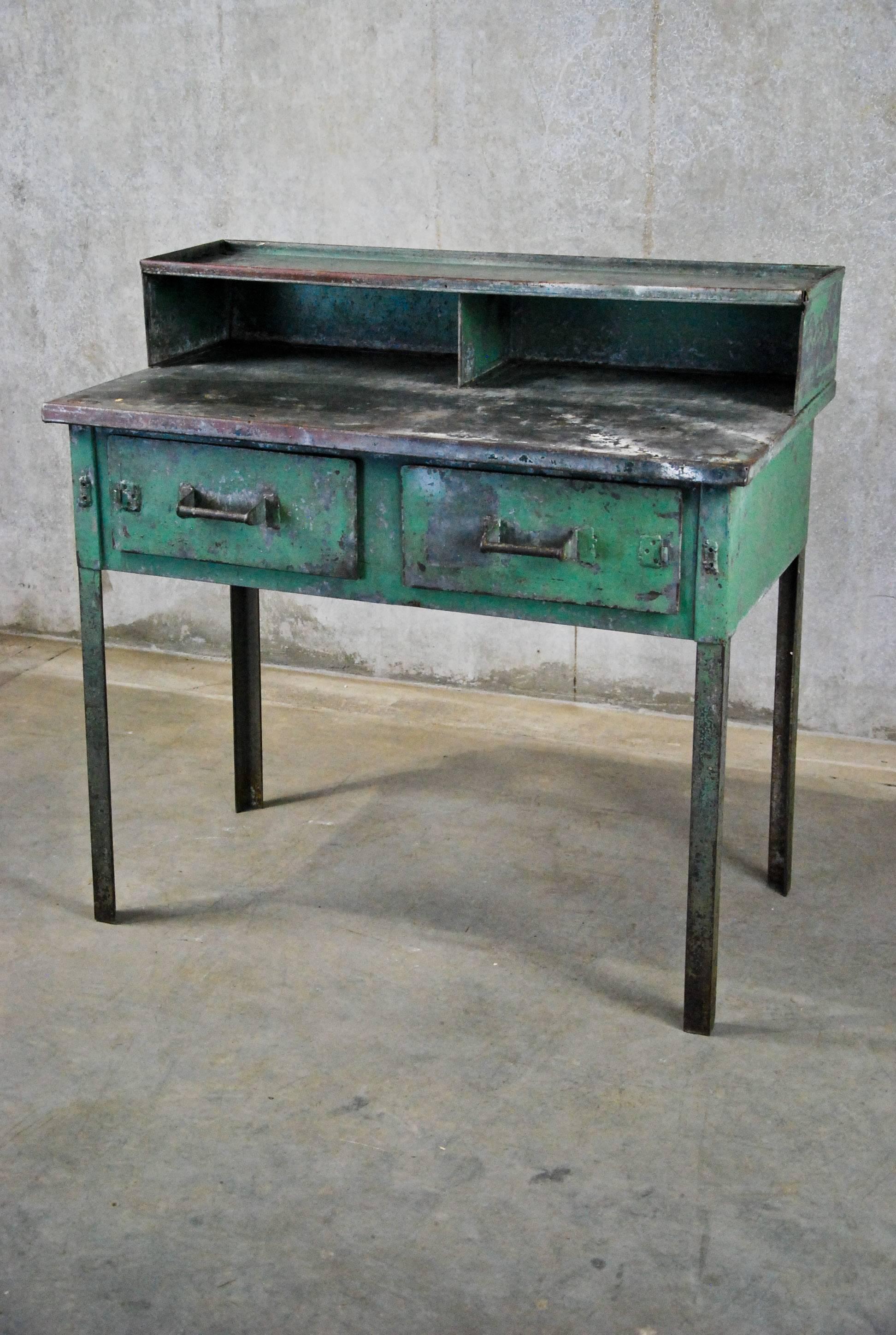Nice Industrial desk with raw wooden shelf and two working steel drawers.
Found in a factory in Seattle.

Great original finish.

           