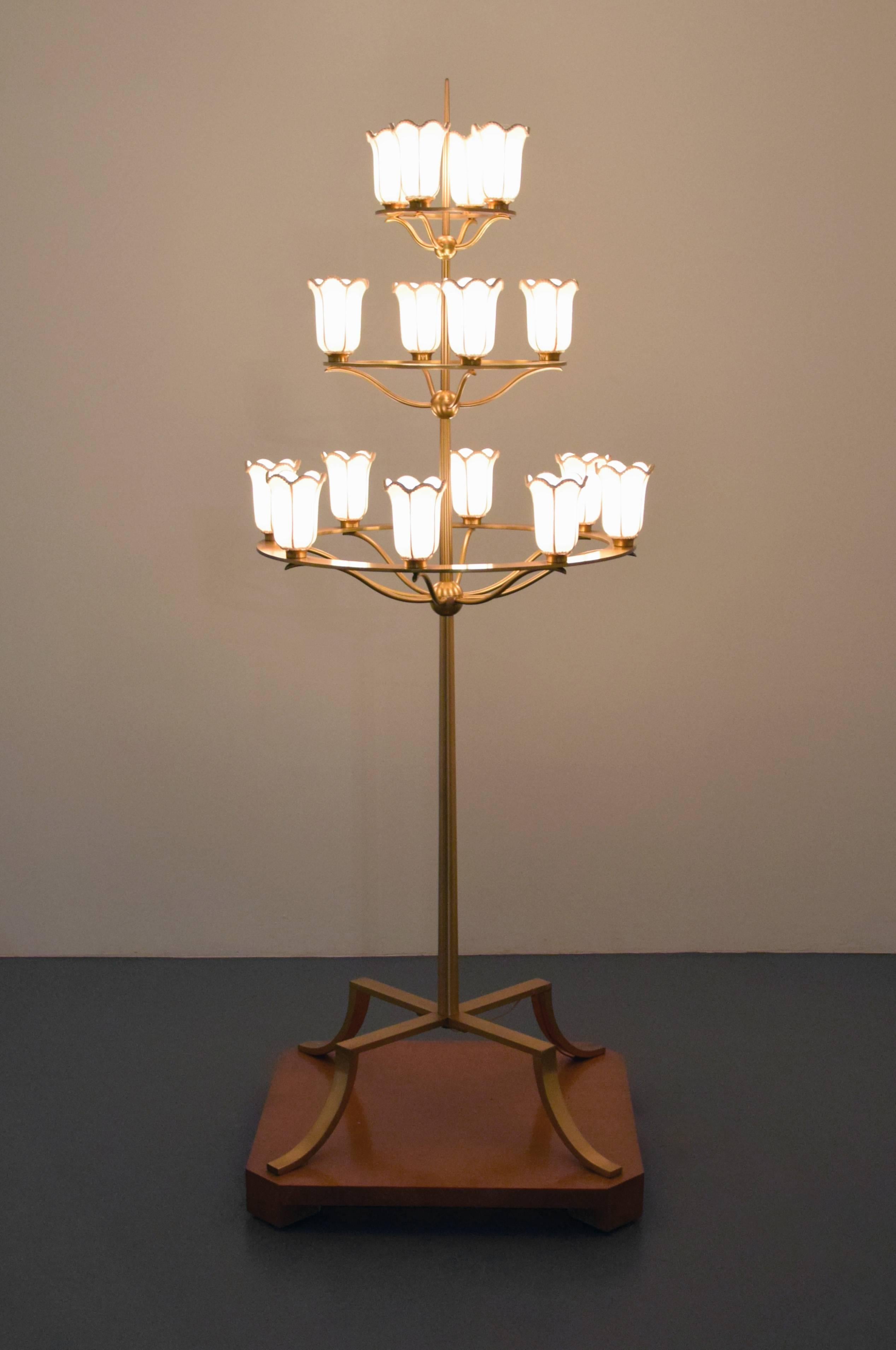 Three-tiered floor lamp with sixteen light sockets designed by T.H. Robsjohn-Gibbings. The lamp is depicted in situ within the book Mr. Tom Davis, White Shadows, Palm Springs, pg. 9. Provenance: Designed by Robsjohn-Gibbings for White Shadows,