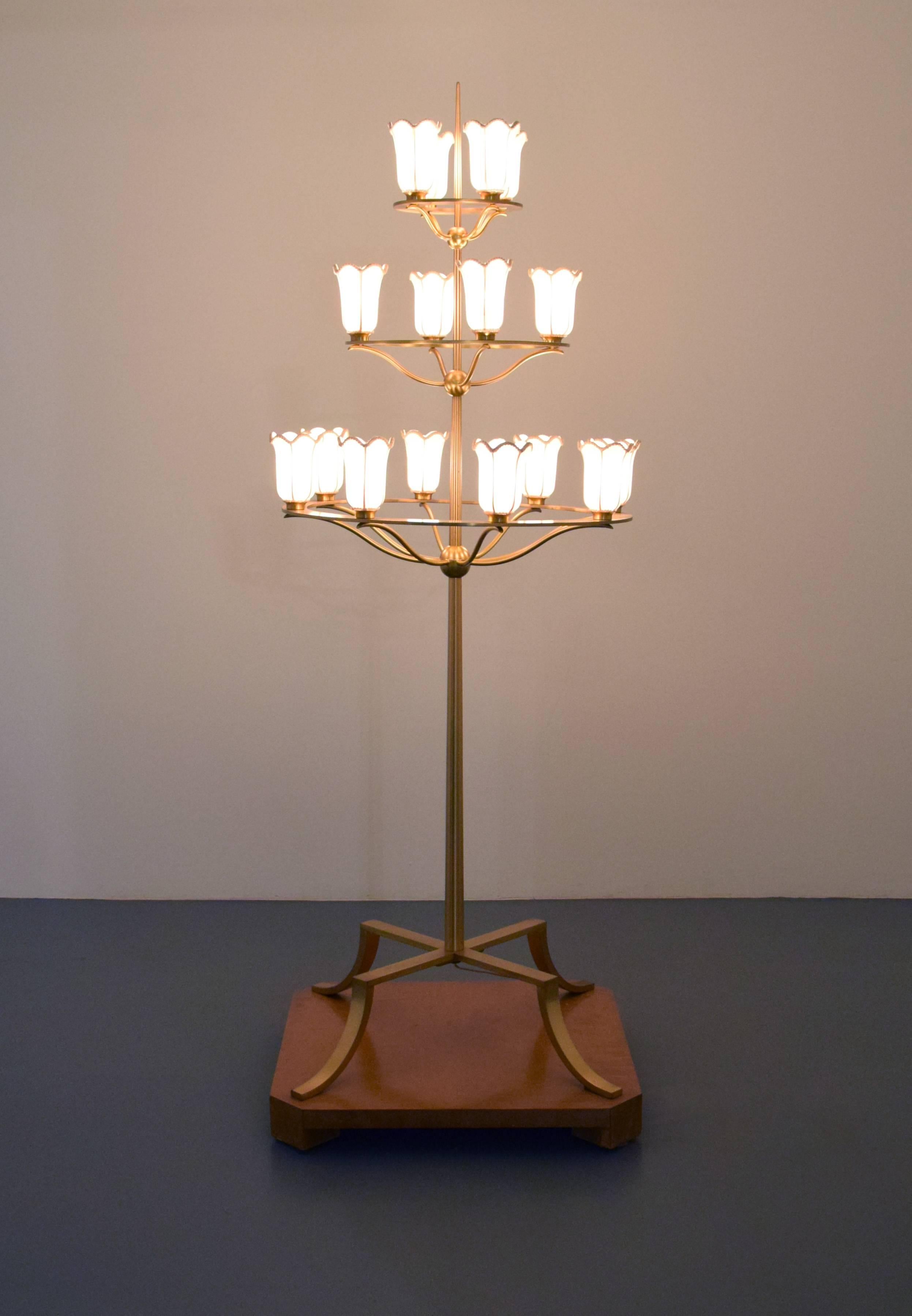 Three-tiered floor lamp with sixteen-light sockets designed by T.H. Robsjohn-Gibbings (we have 2 available, priced each). The lamp is depicted in situ within the book Mr. Tom Davis, White Shadows, Palm Springs, pg. 9. Provenance: Designed by