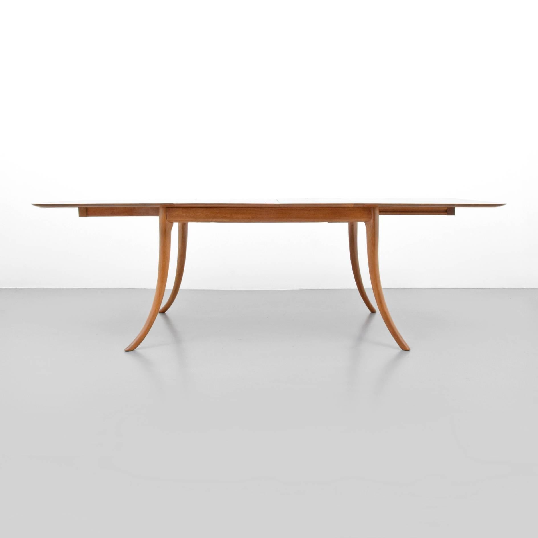 Dining table by T.H. Robsjohn Gibbings for Widdicomb. Table is model #4309, has saber/splayed legs and two leaves. Table is marked.

Dimensions: 29" H, 93.75" W, 38" D, 57.75" W without leaves, leaves are 16" W &